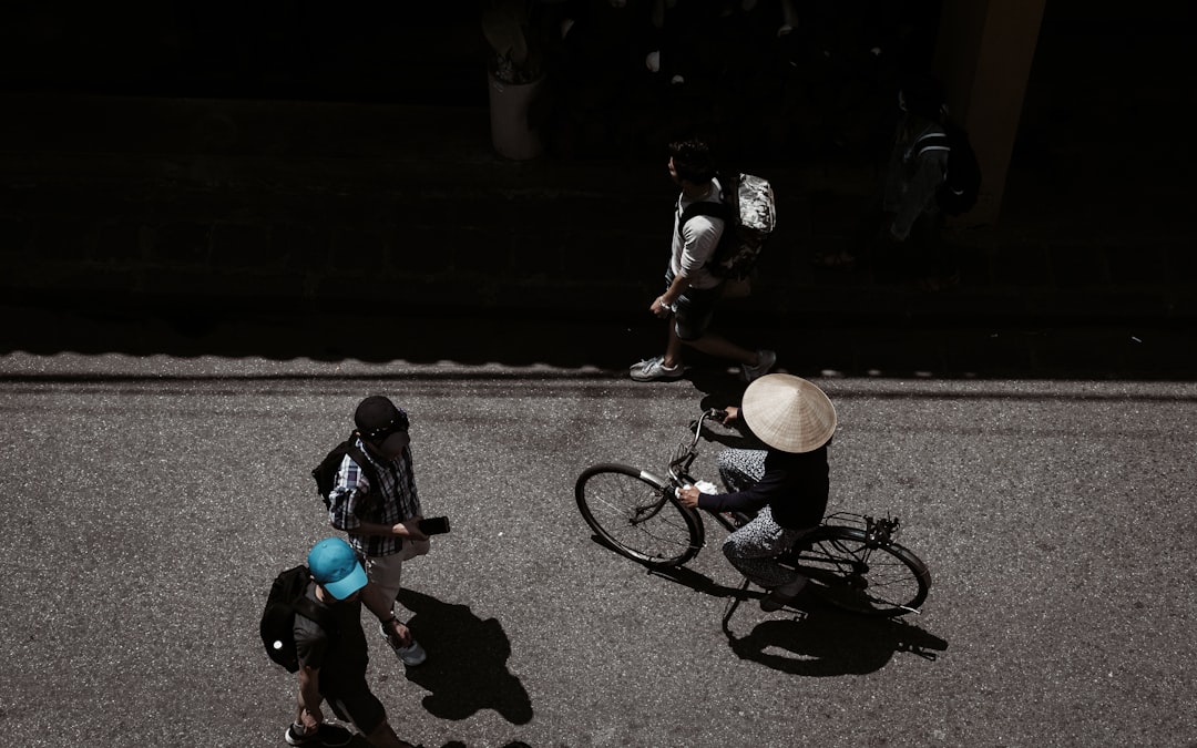 Group of road cyclists riding together outdoors on paved roads.