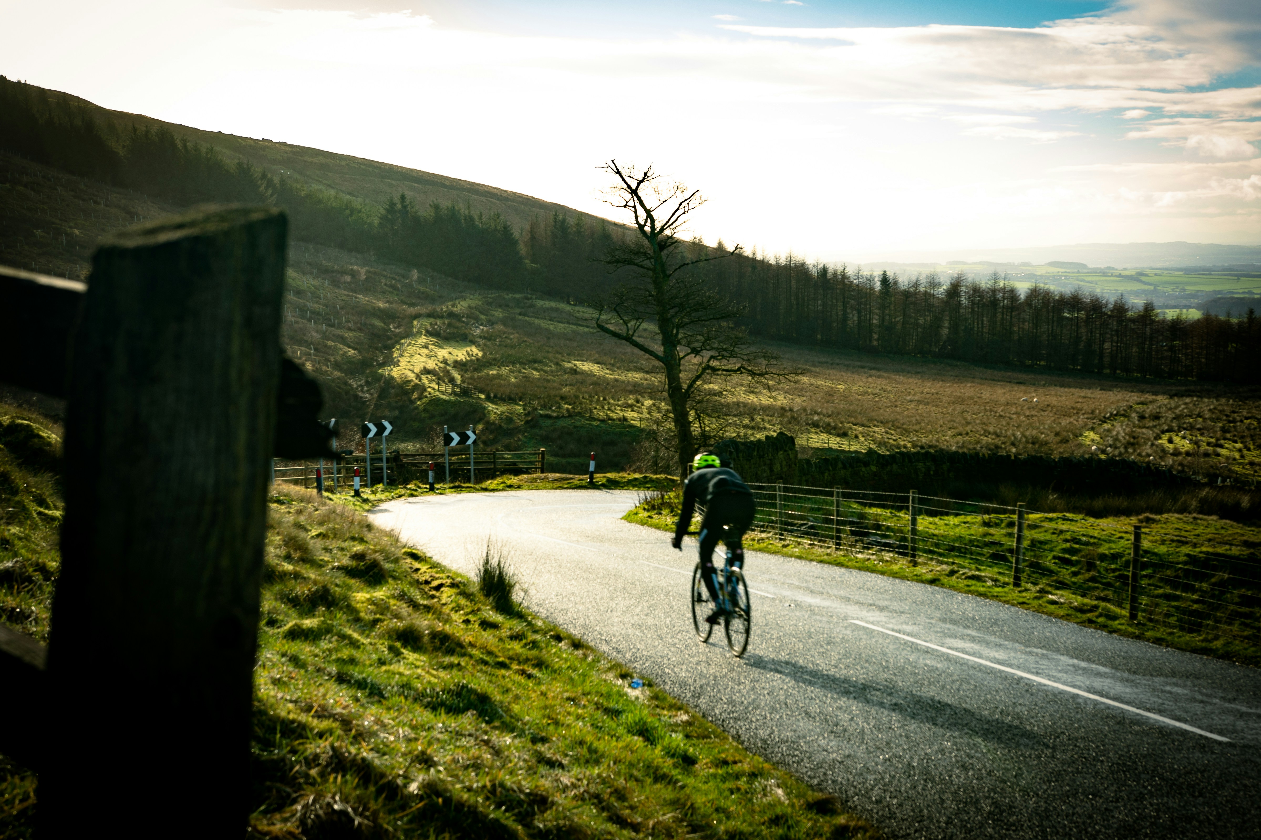 Cyclist riding a road bike outdoors in real conditions.