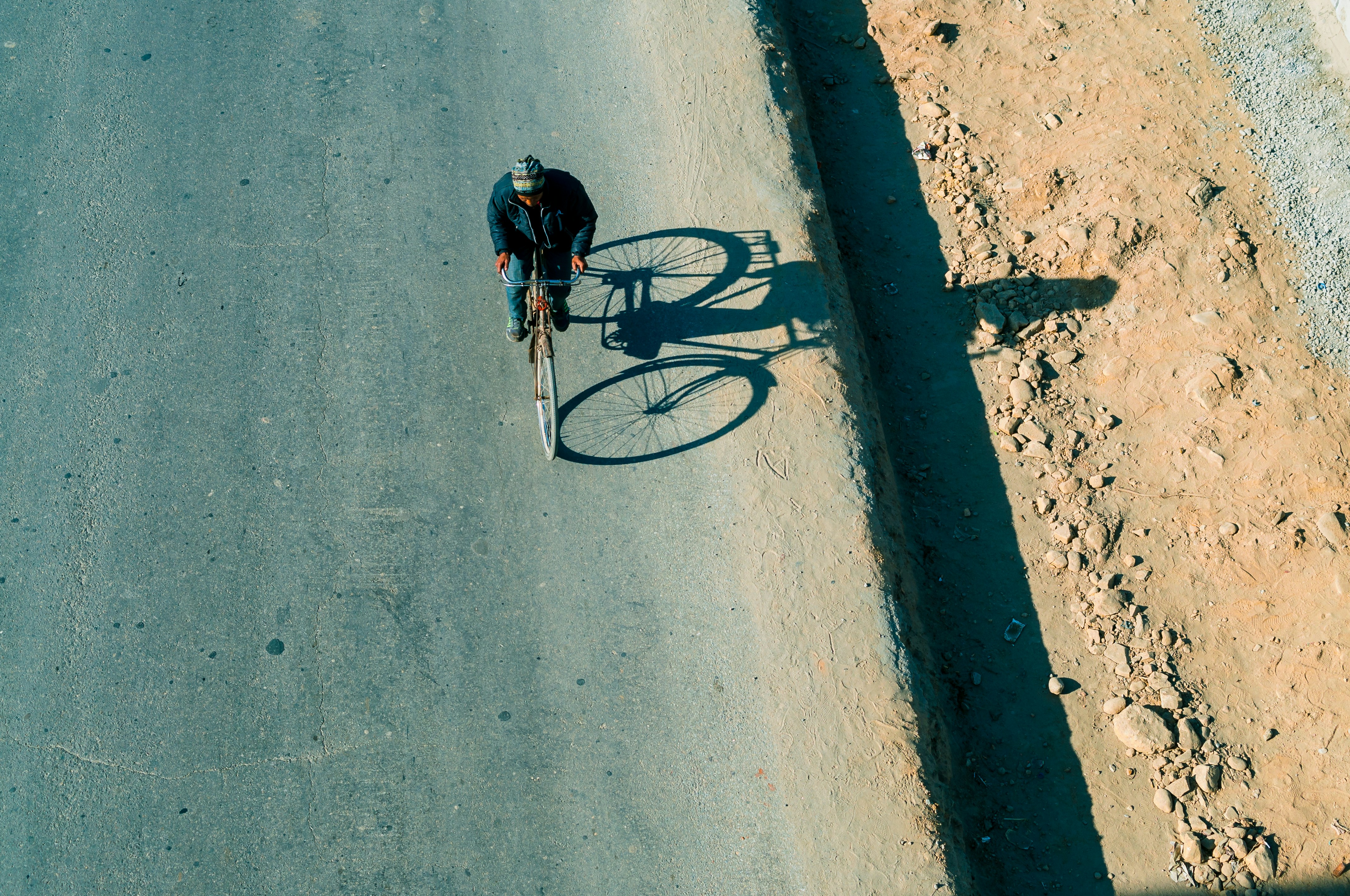 Cyclist riding a road bike outdoors in real conditions.