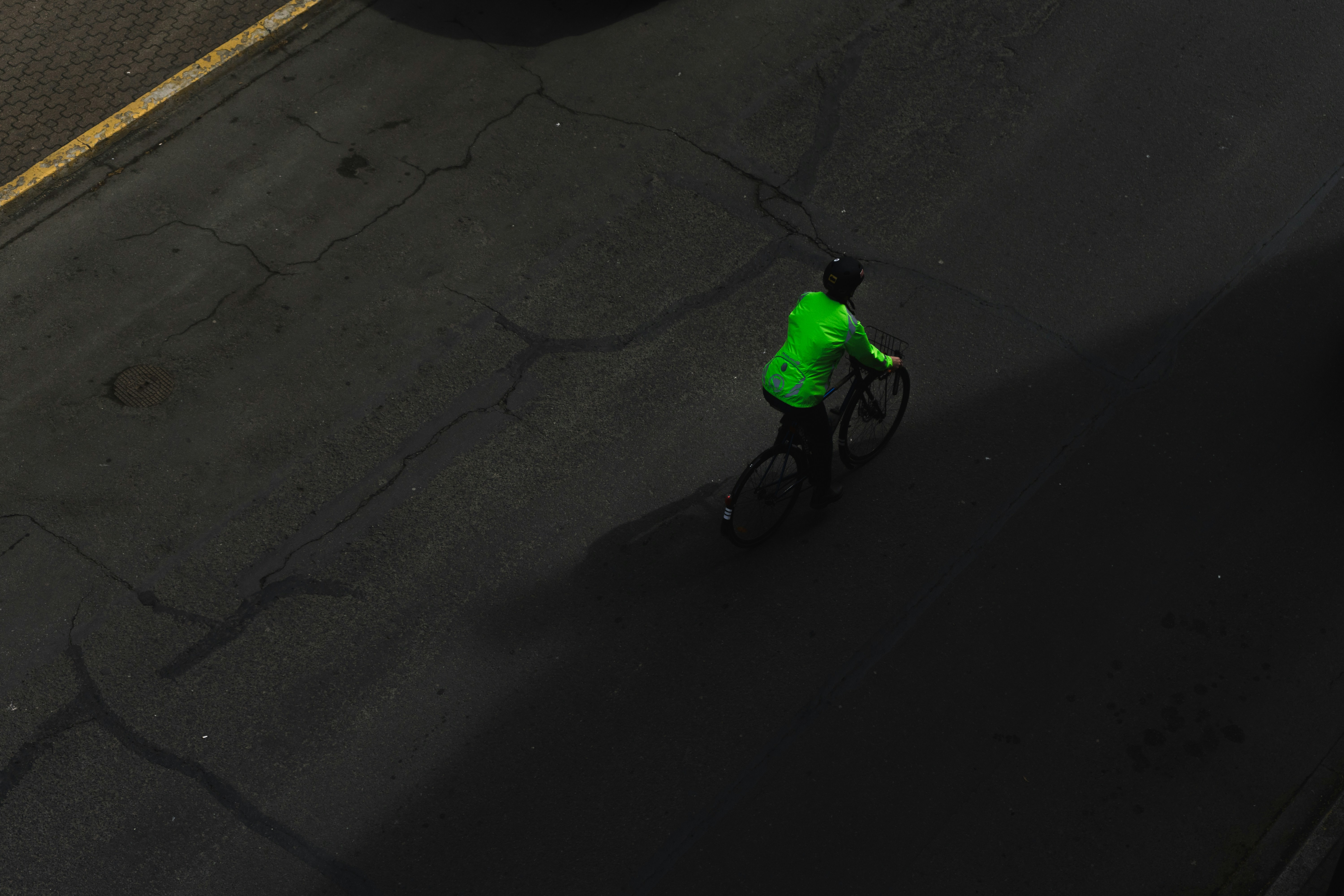 Cyclist riding a road bike outdoors in real conditions.