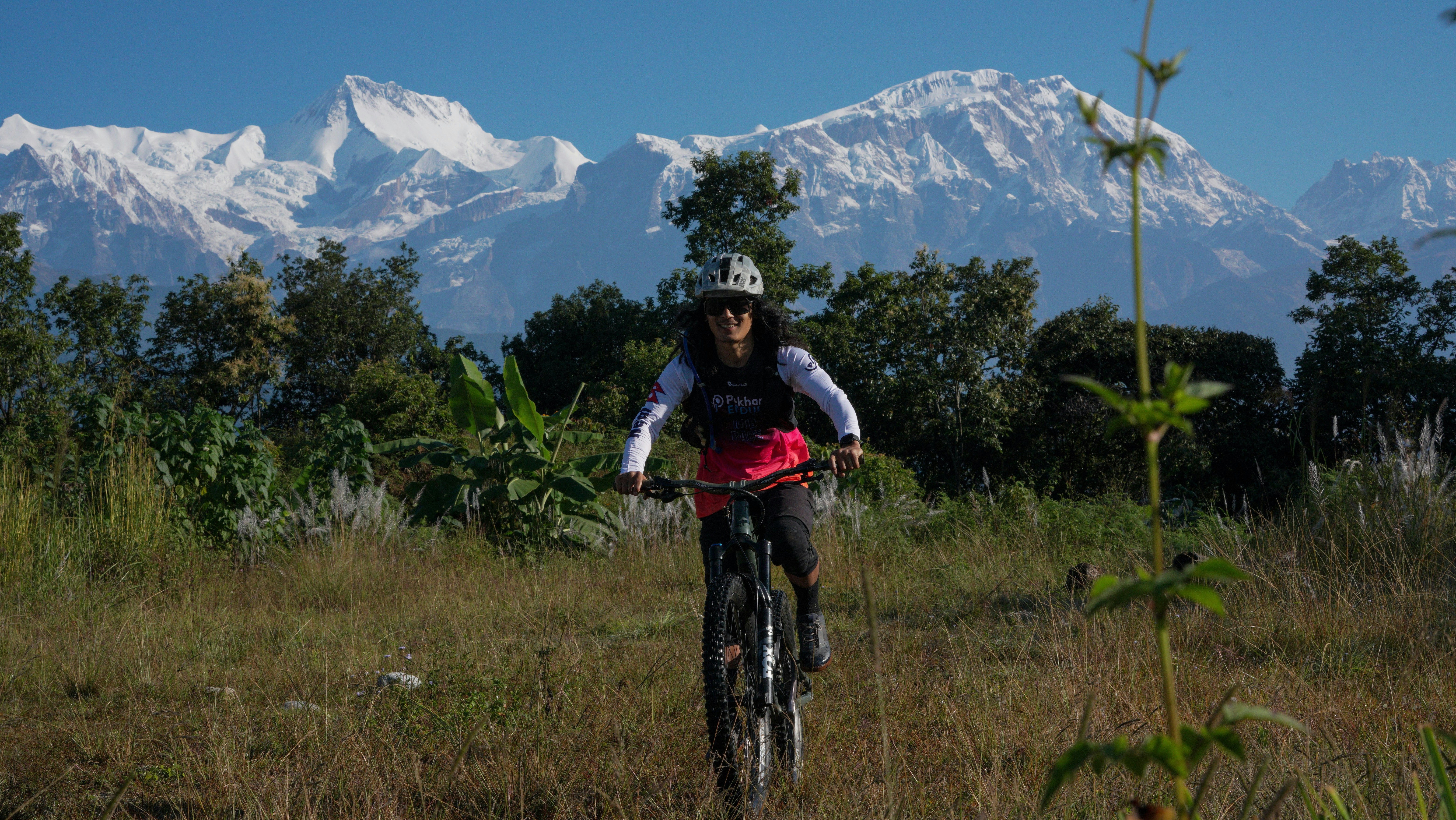 Cyclist riding a road bike outdoors in real conditions.