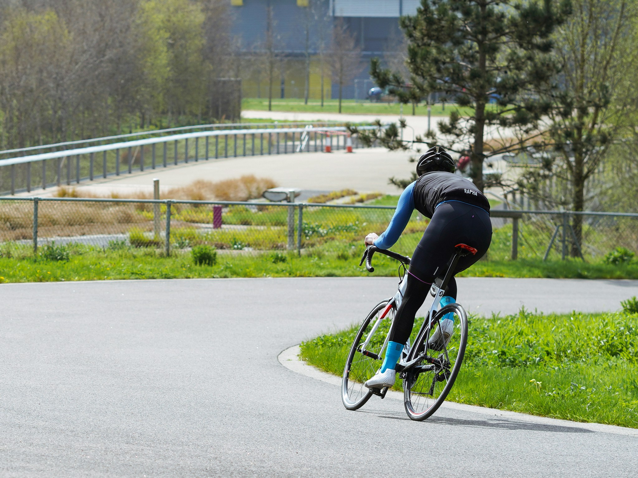 Cyclist riding a road bike outdoors in real conditions.