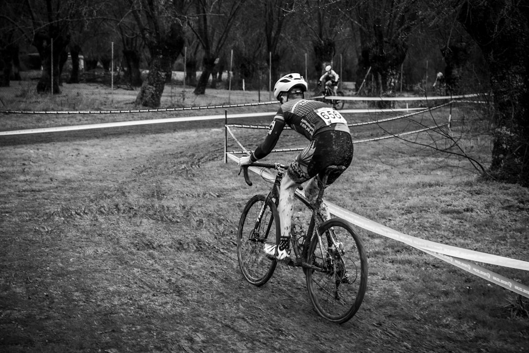 Group of road cyclists riding together outdoors on paved roads.