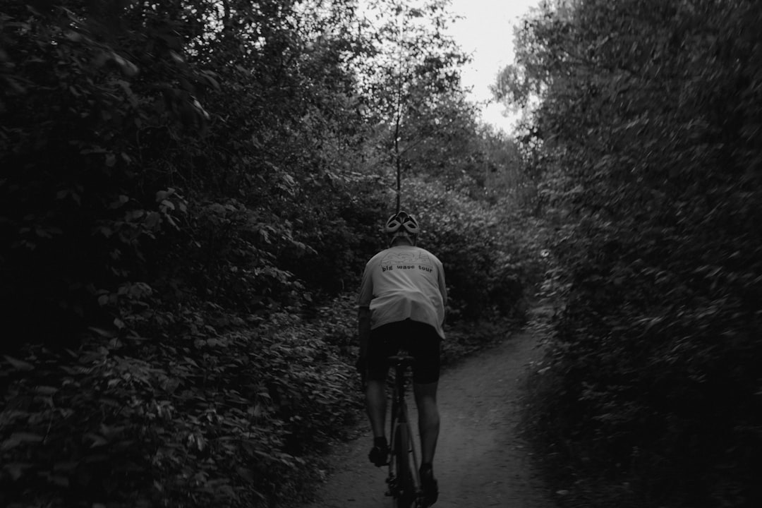 Group of road cyclists riding together outdoors on paved roads.