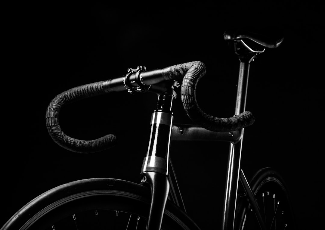 Group of road cyclists riding together outdoors on paved roads.