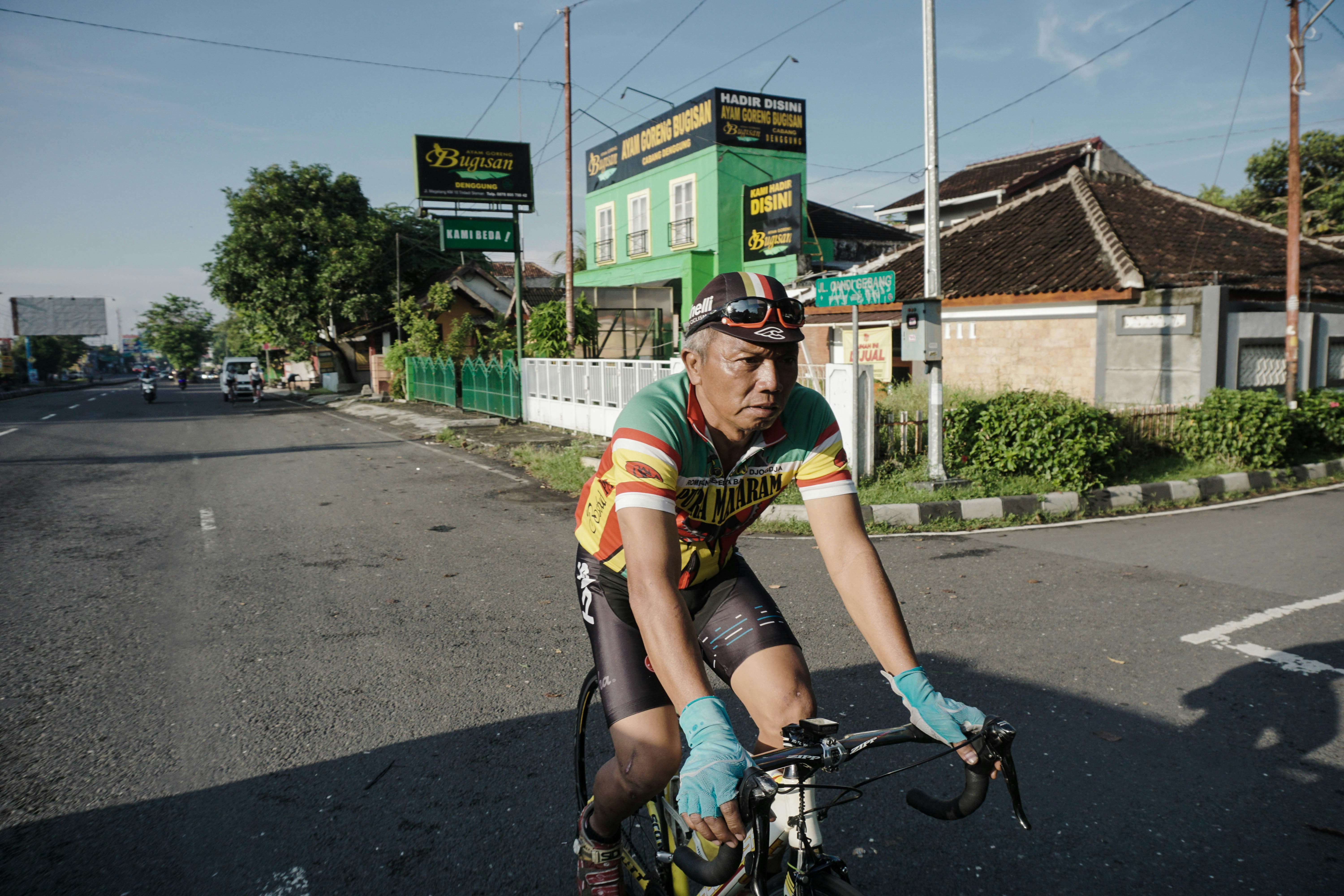 Cyclist riding a road bike outdoors in real conditions.
