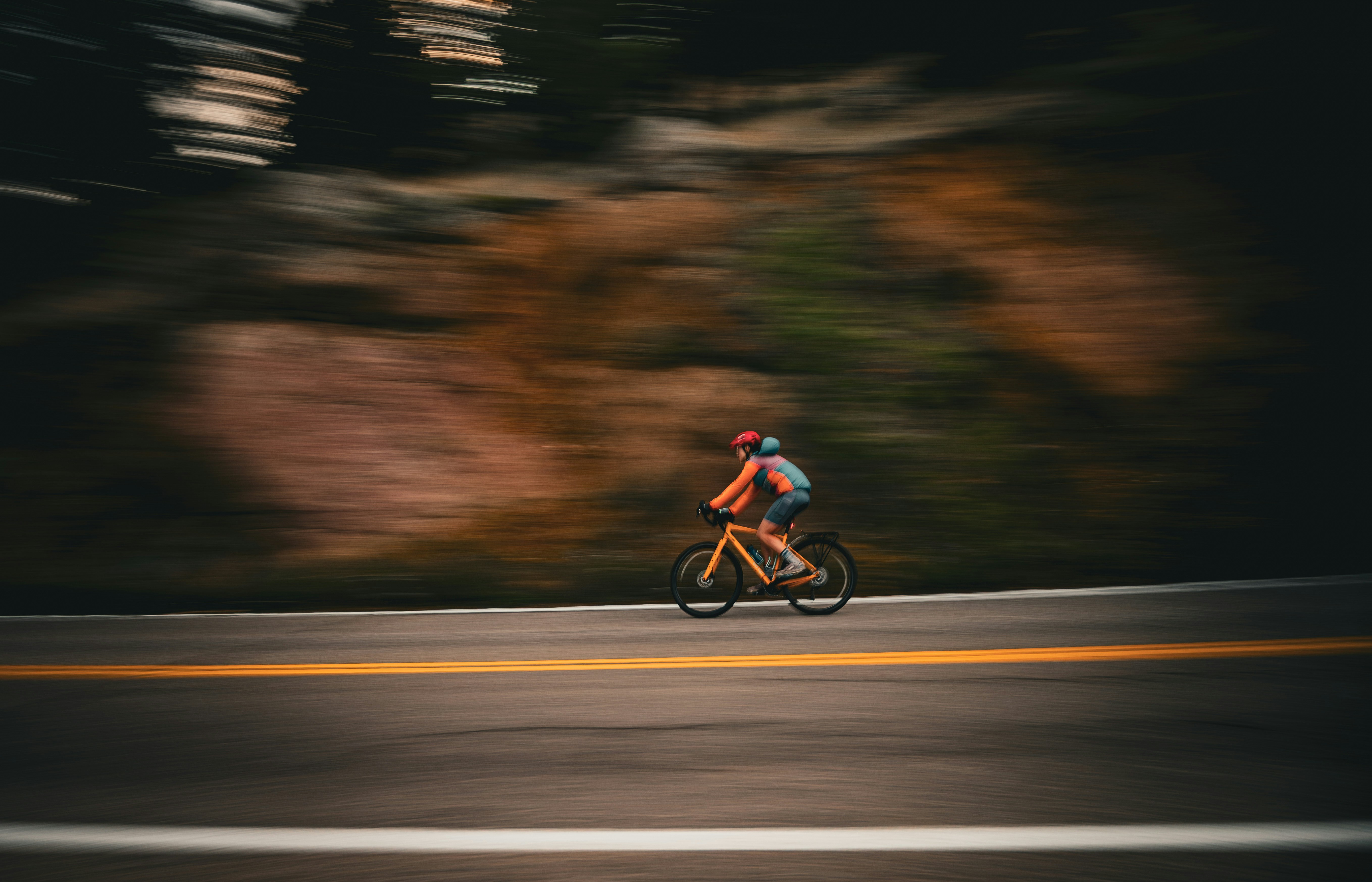 Cyclist riding a road bike outdoors in real conditions.