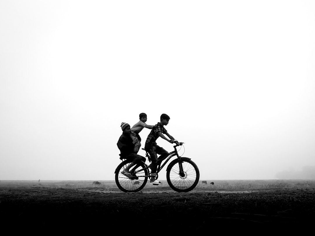 Group of road cyclists riding together outdoors on paved roads.