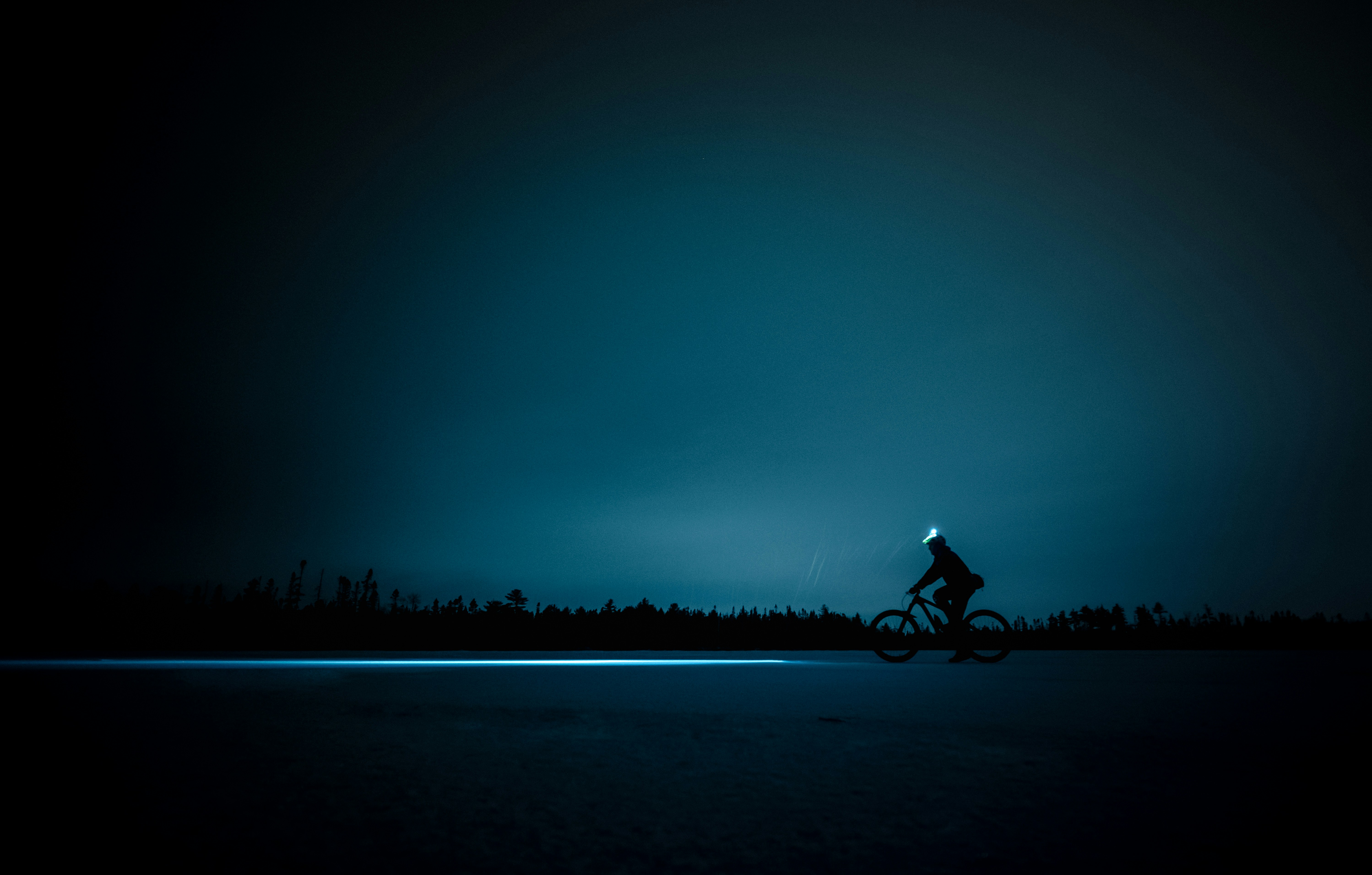 Cyclist riding a road bike outdoors in real conditions.
