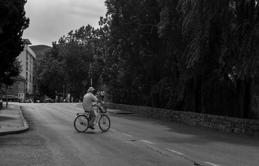 Group of road cyclists riding together outdoors on paved roads.