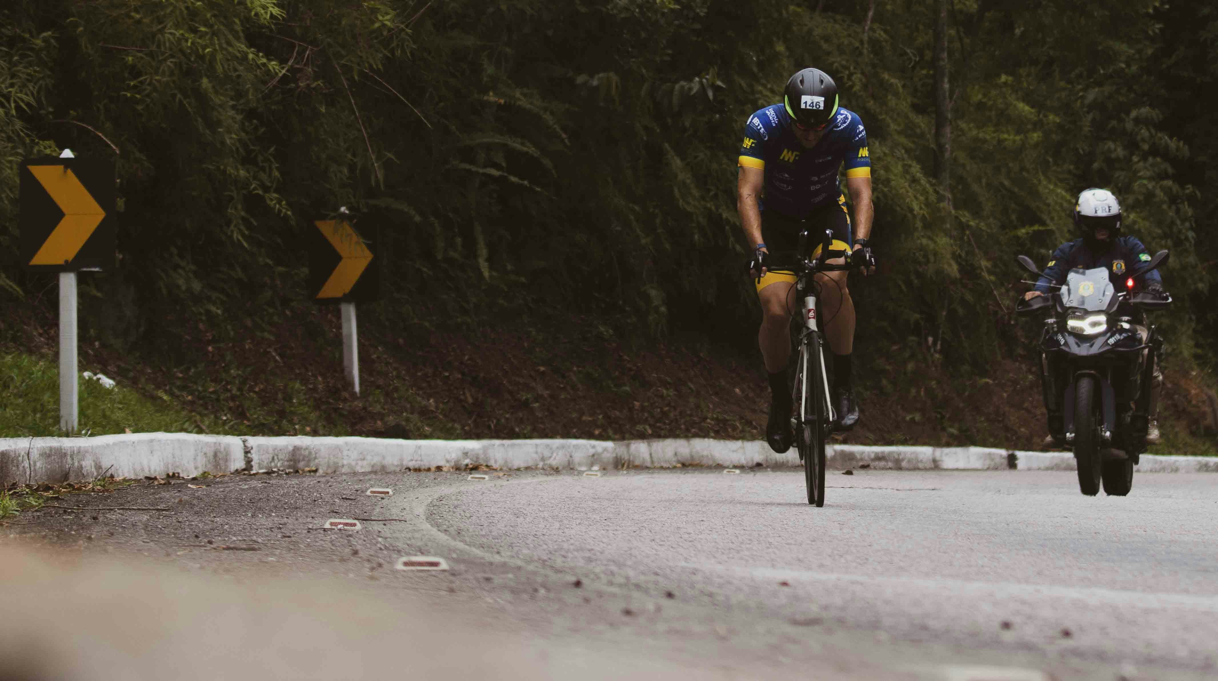 Cyclist riding a road bike outdoors in real conditions.