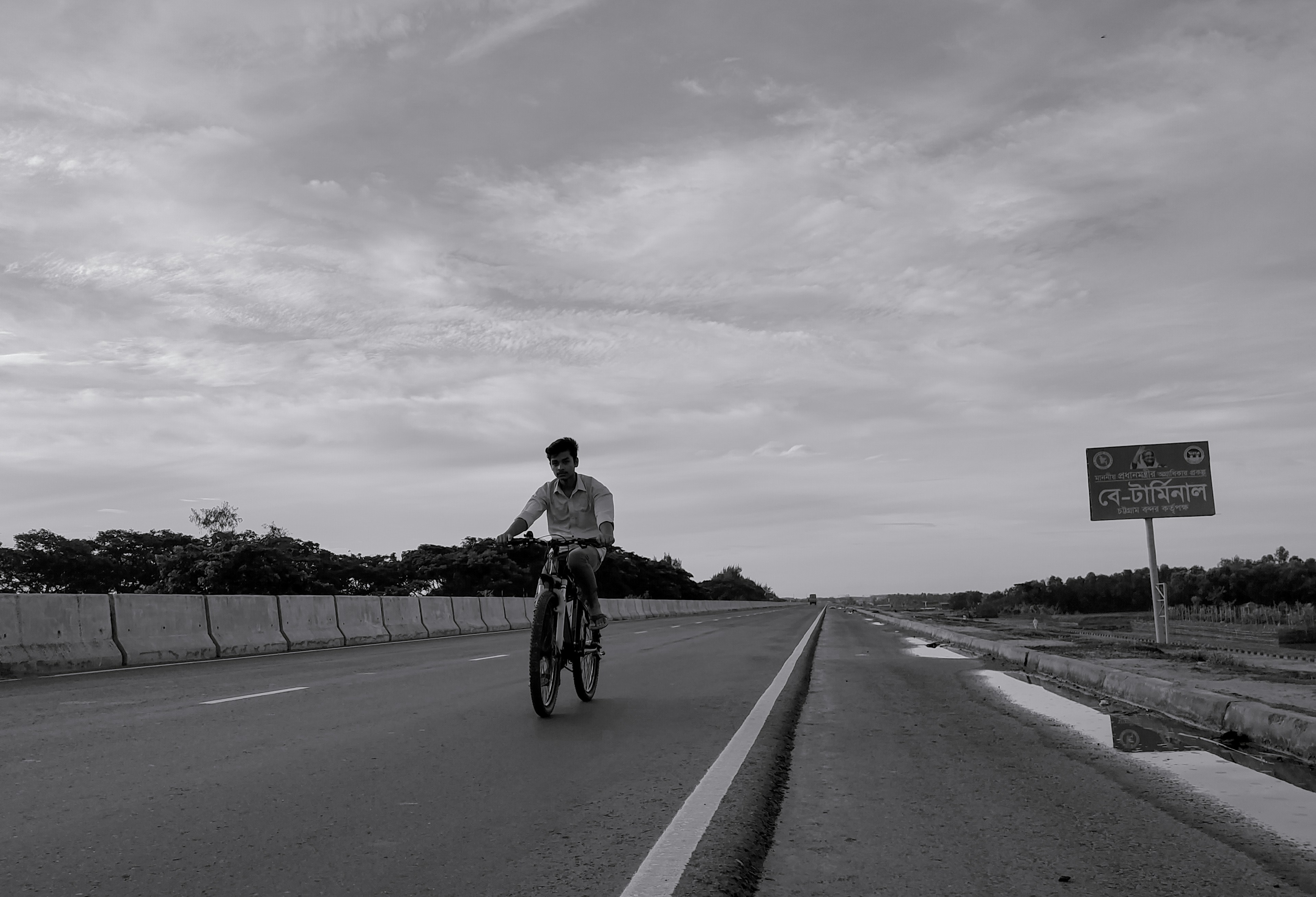 Cyclist riding a road bike outdoors in real conditions.