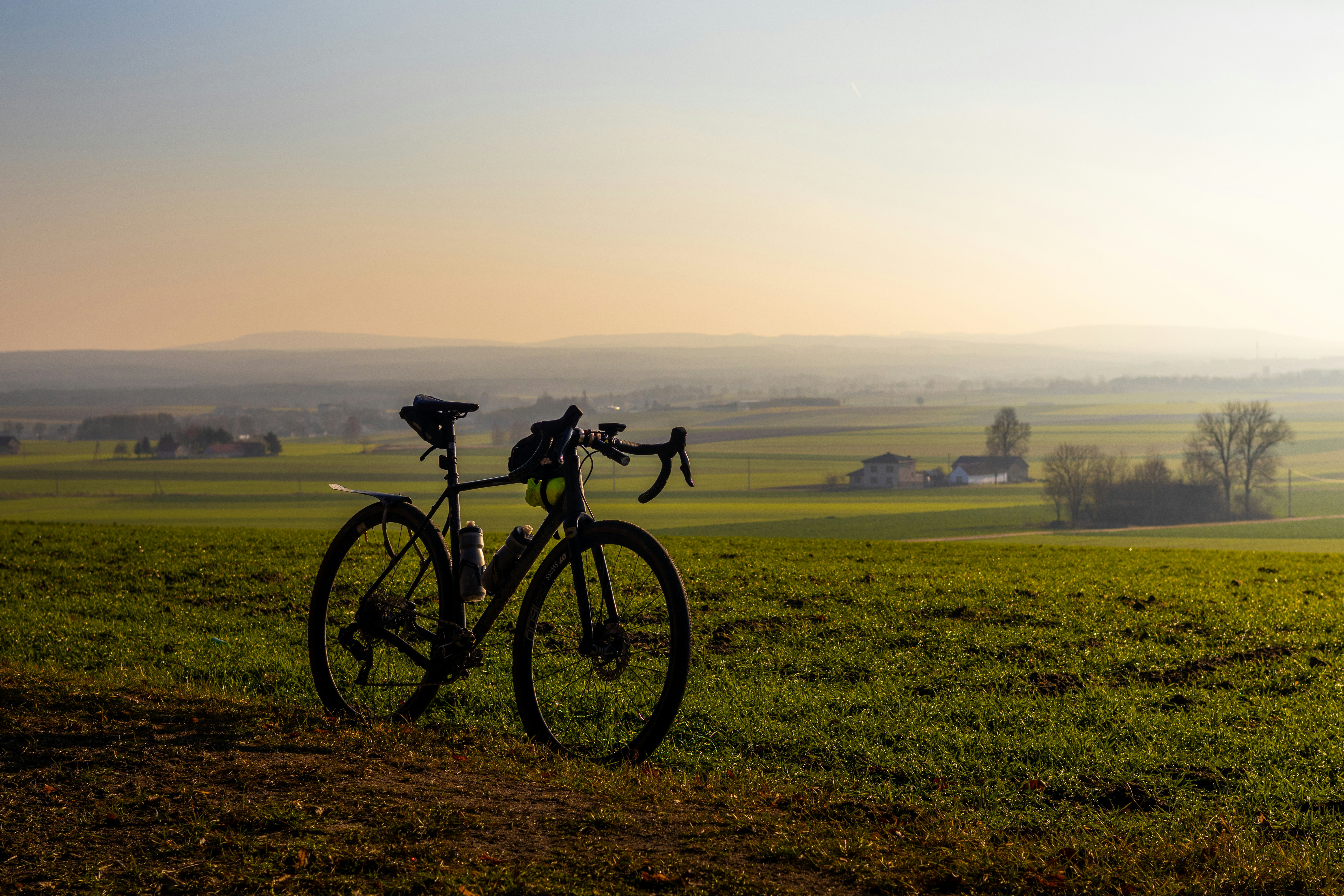 Cyclist riding a road bike outdoors in real conditions.