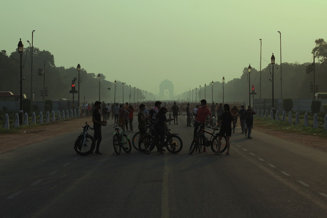 Group of road cyclists riding together outdoors on paved roads.