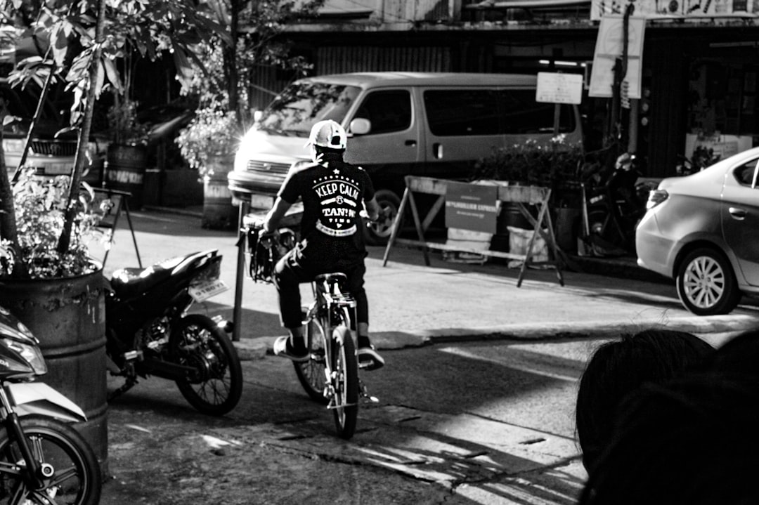 Group of road cyclists riding together outdoors on paved roads.