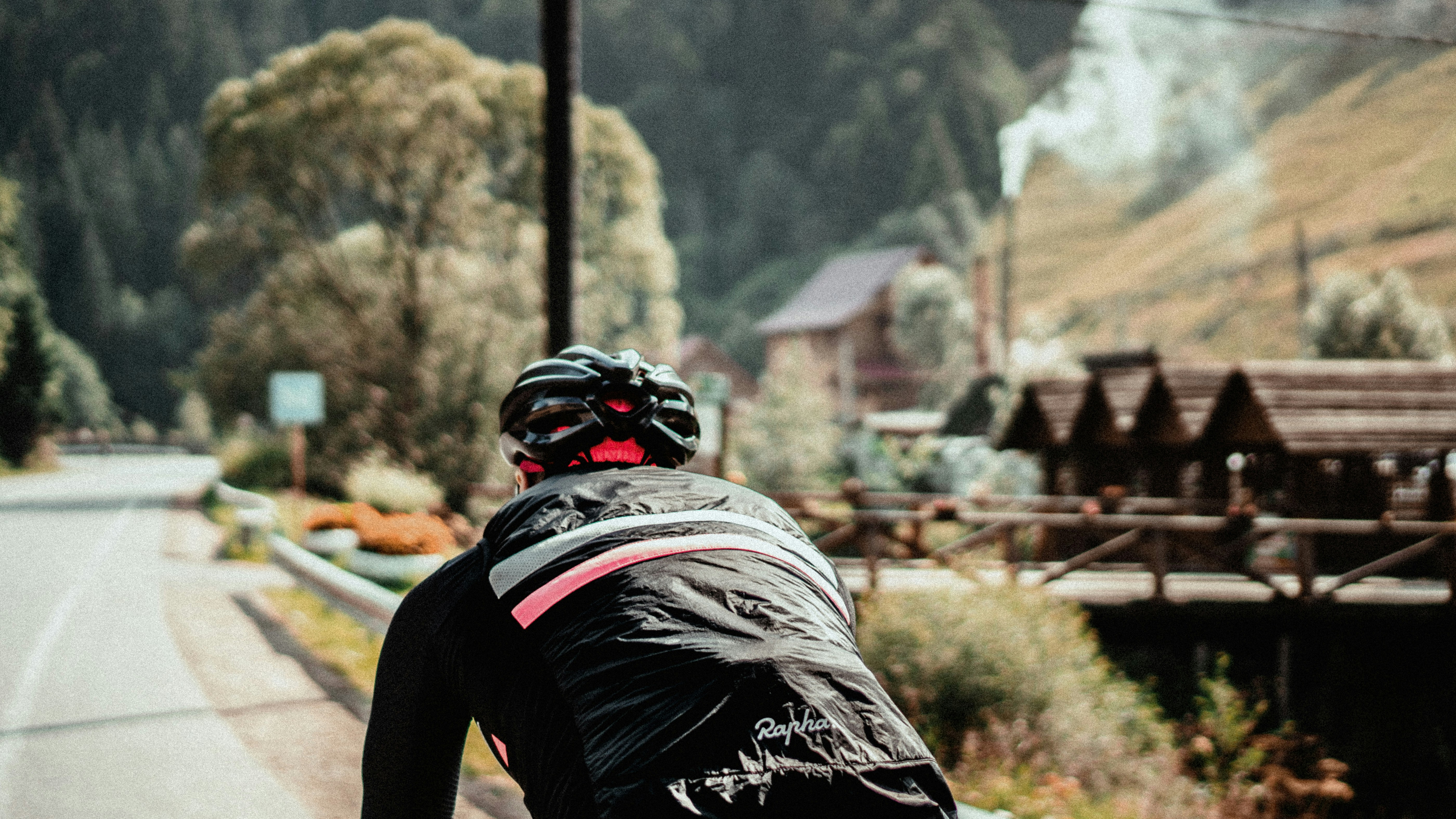 Cyclist riding a road bike outdoors in real conditions.