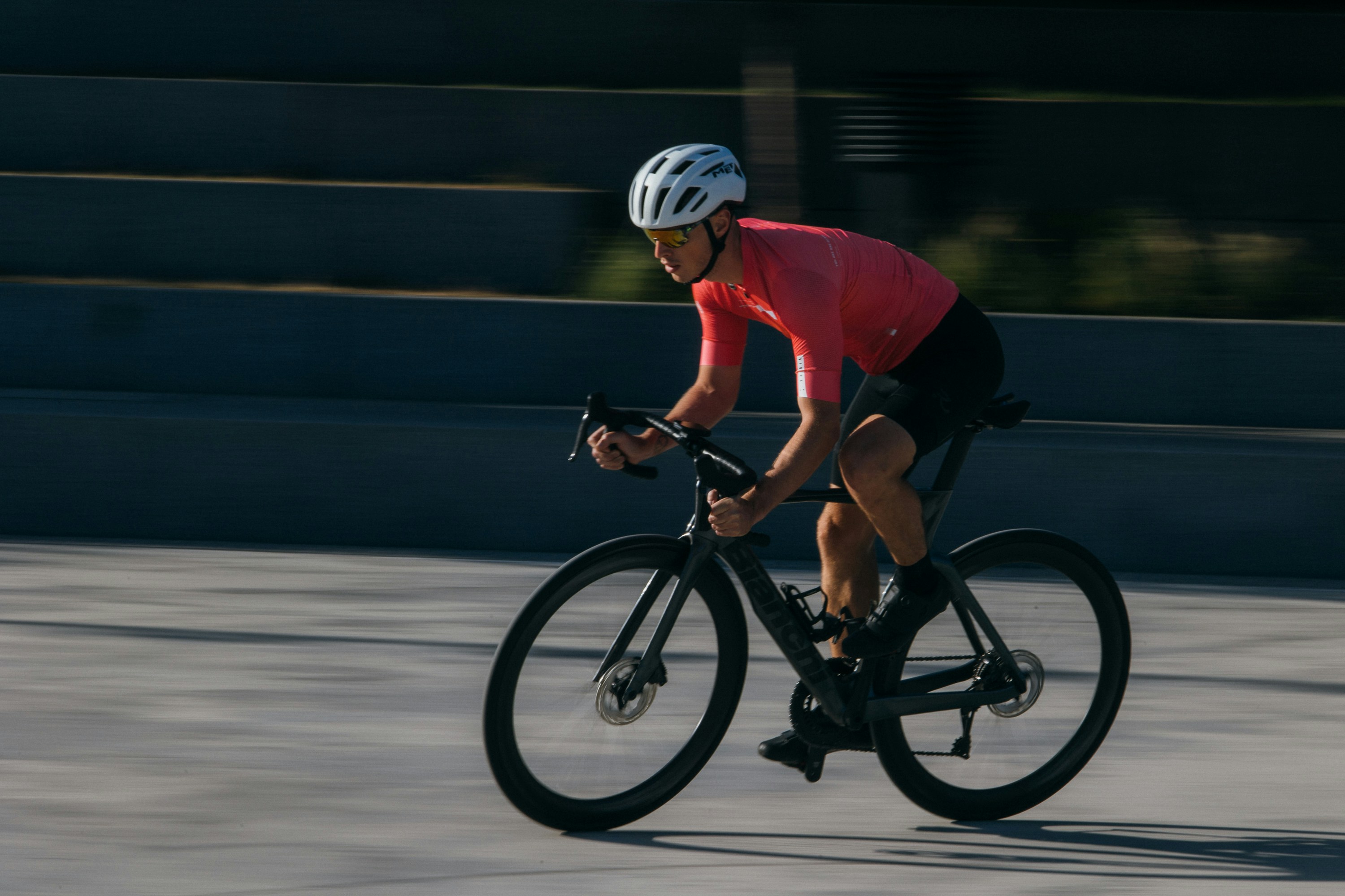 Cyclist riding a road bike outdoors in real conditions.