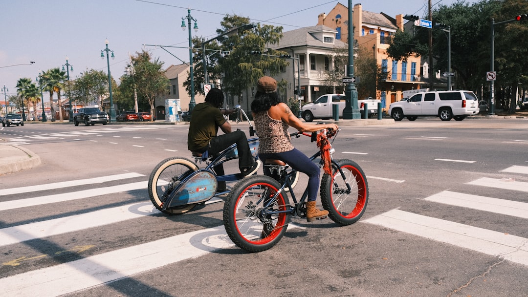 Group of road cyclists riding together outdoors on paved roads.