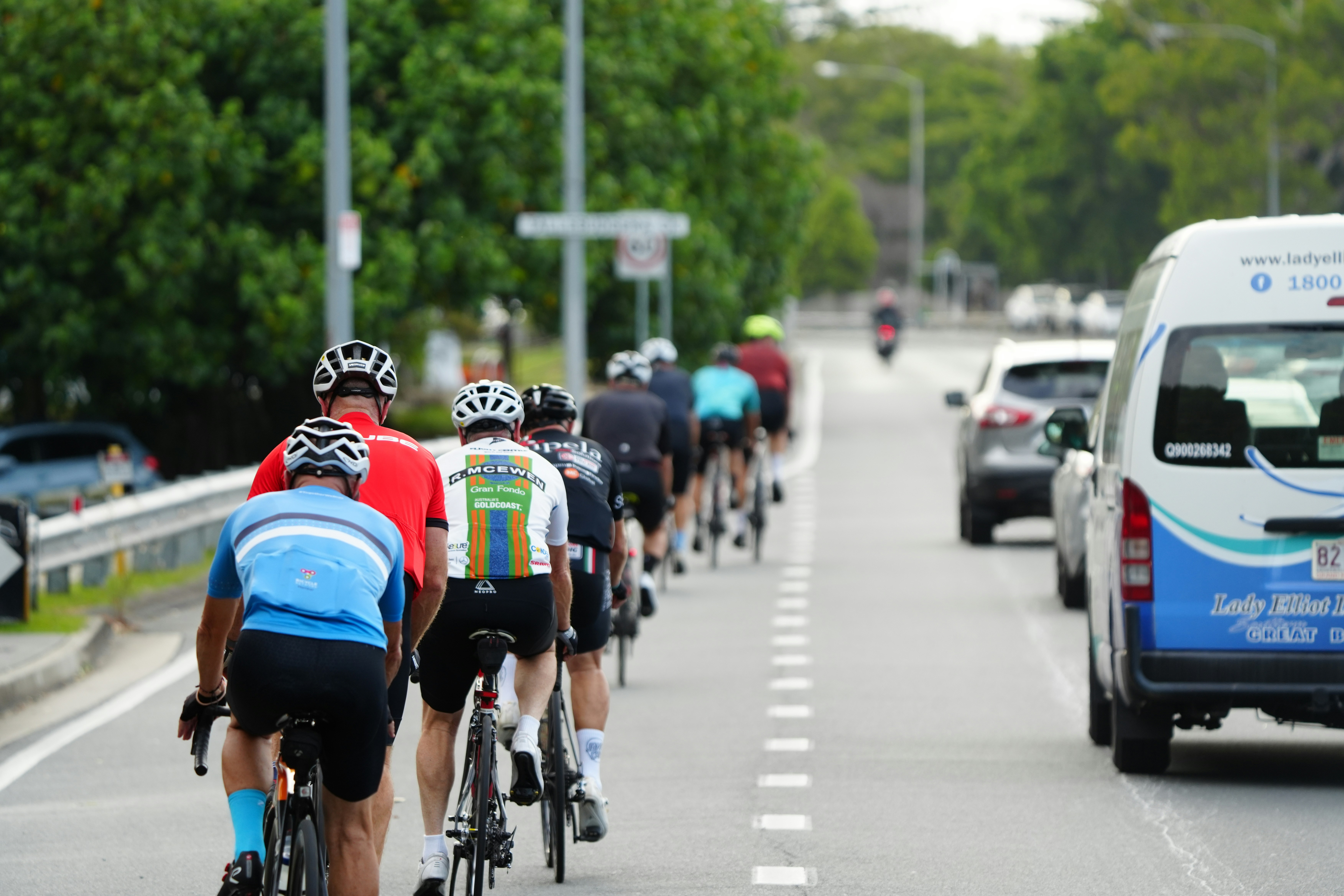 Cyclist riding a road bike outdoors in real conditions.