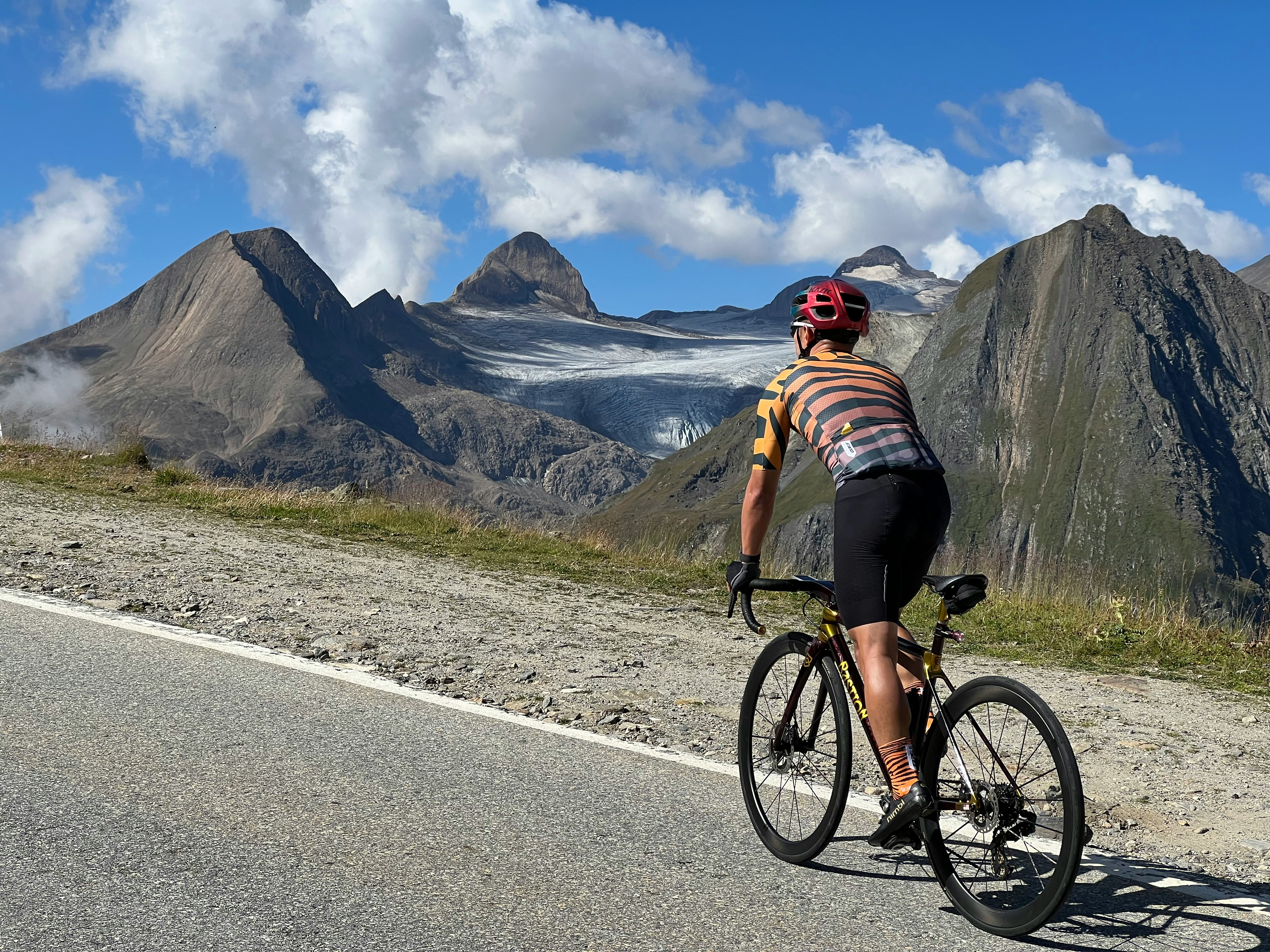Cyclist riding a road bike outdoors in real conditions.