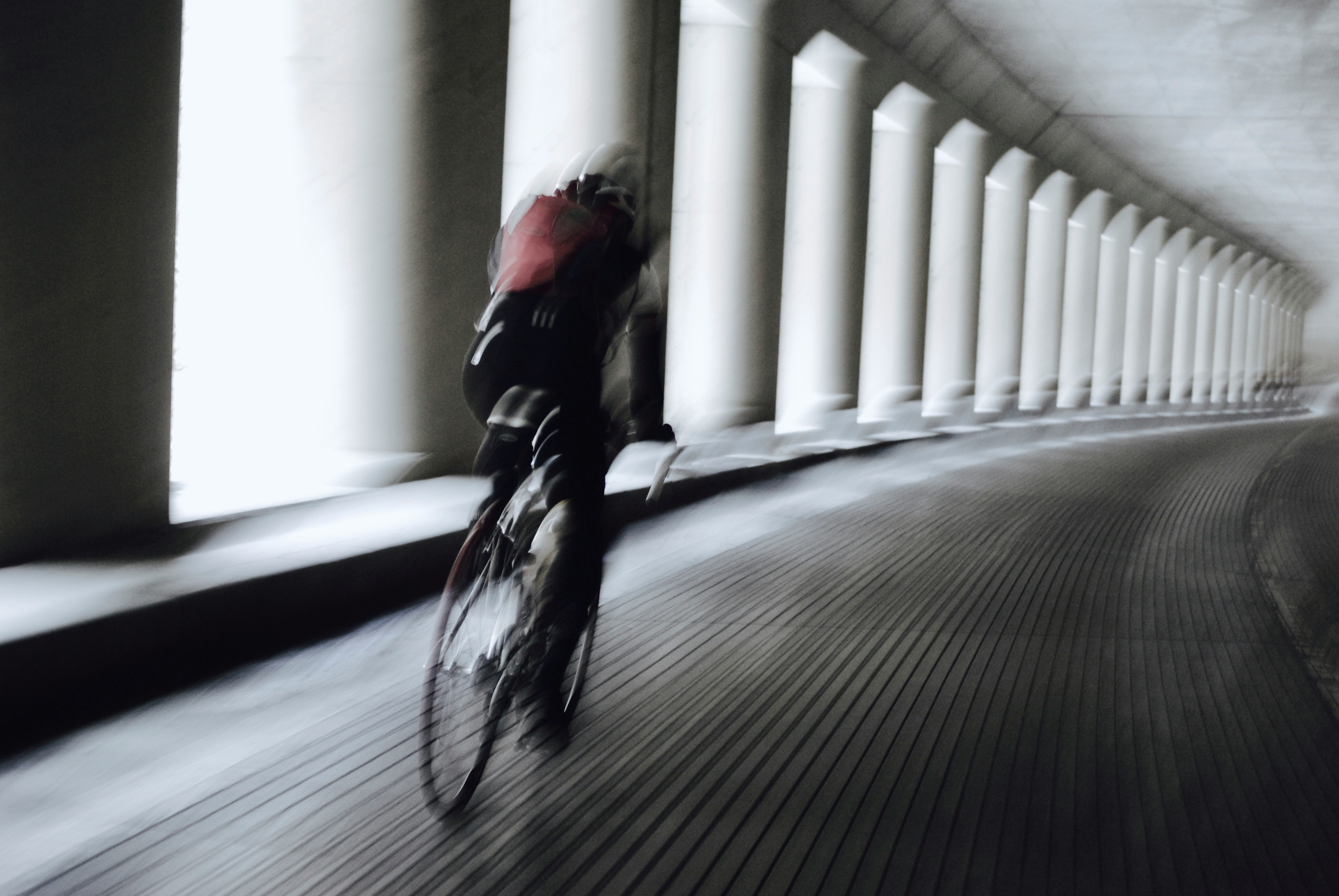 Cyclist riding a road bike outdoors in real conditions.