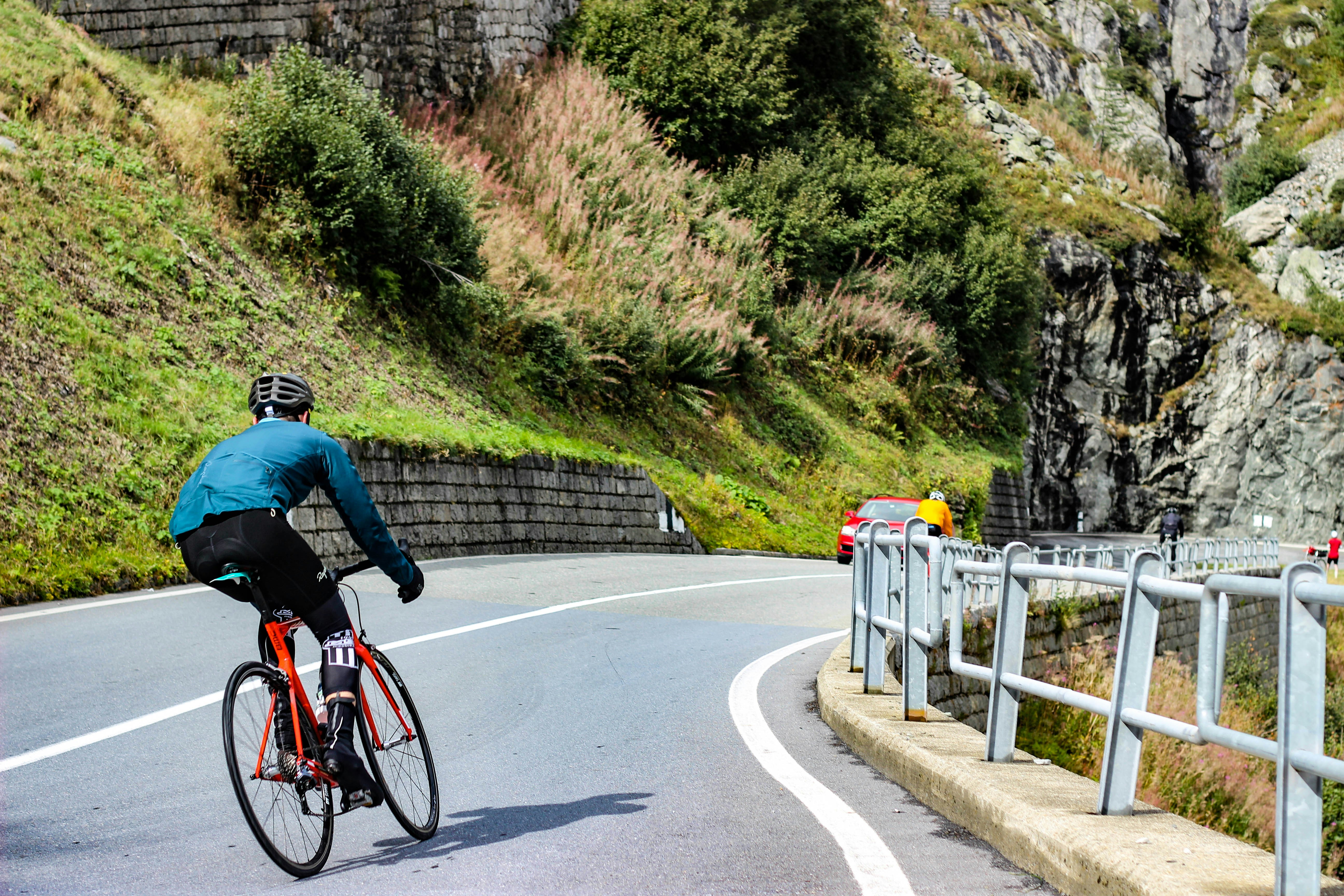 Cyclist riding a road bike outdoors in real conditions.