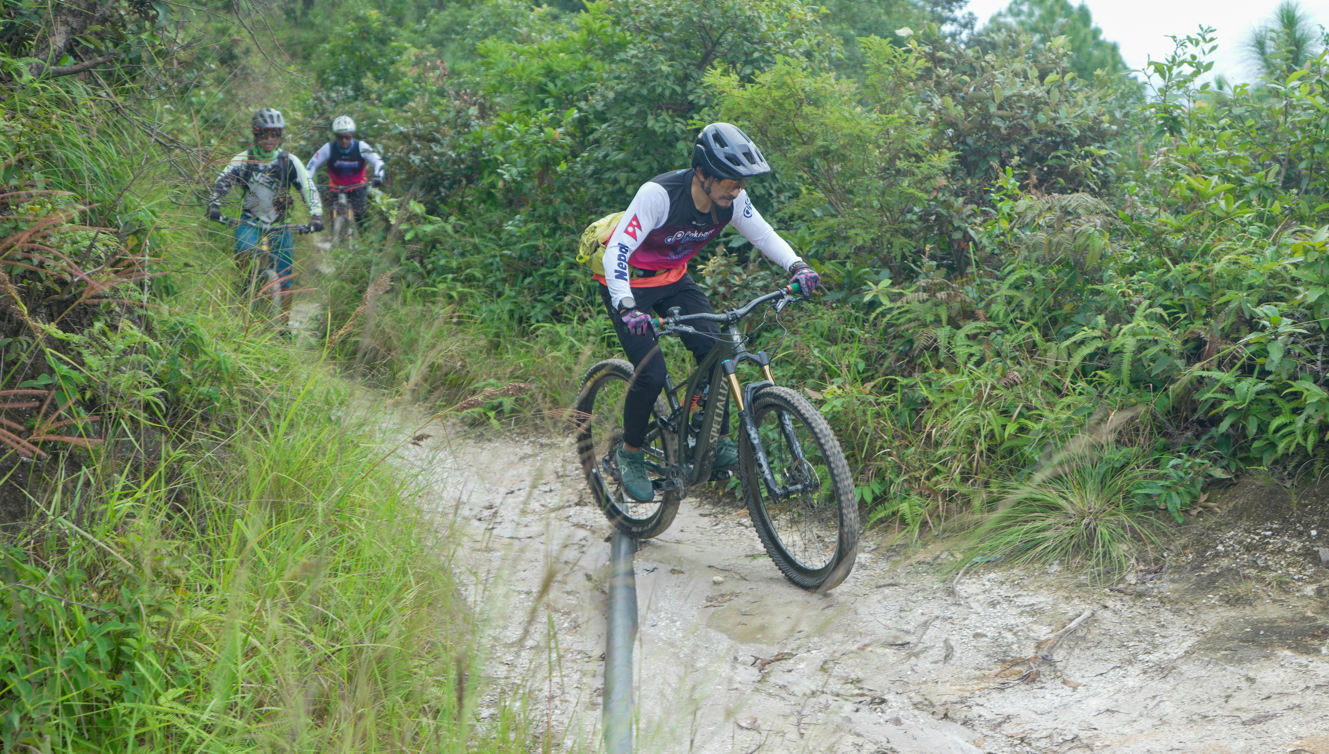 Cyclist riding a road bike outdoors in real conditions.