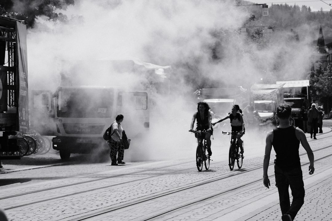 Group of road cyclists riding together outdoors on paved roads.