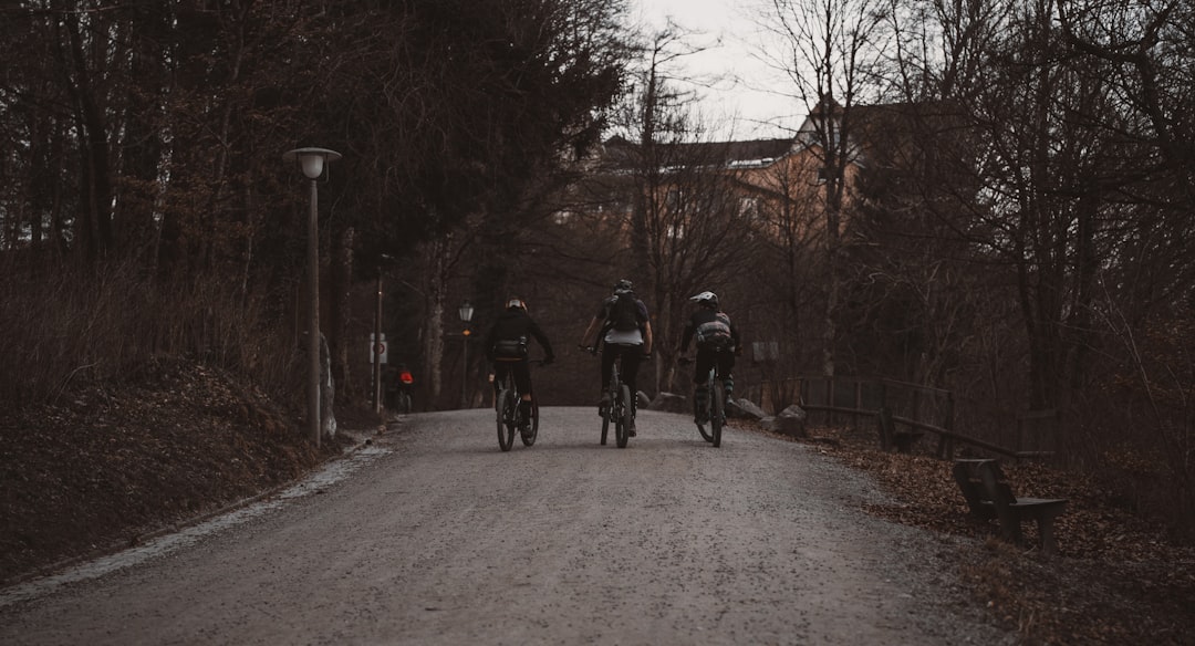 Group of road cyclists riding together outdoors on paved roads.