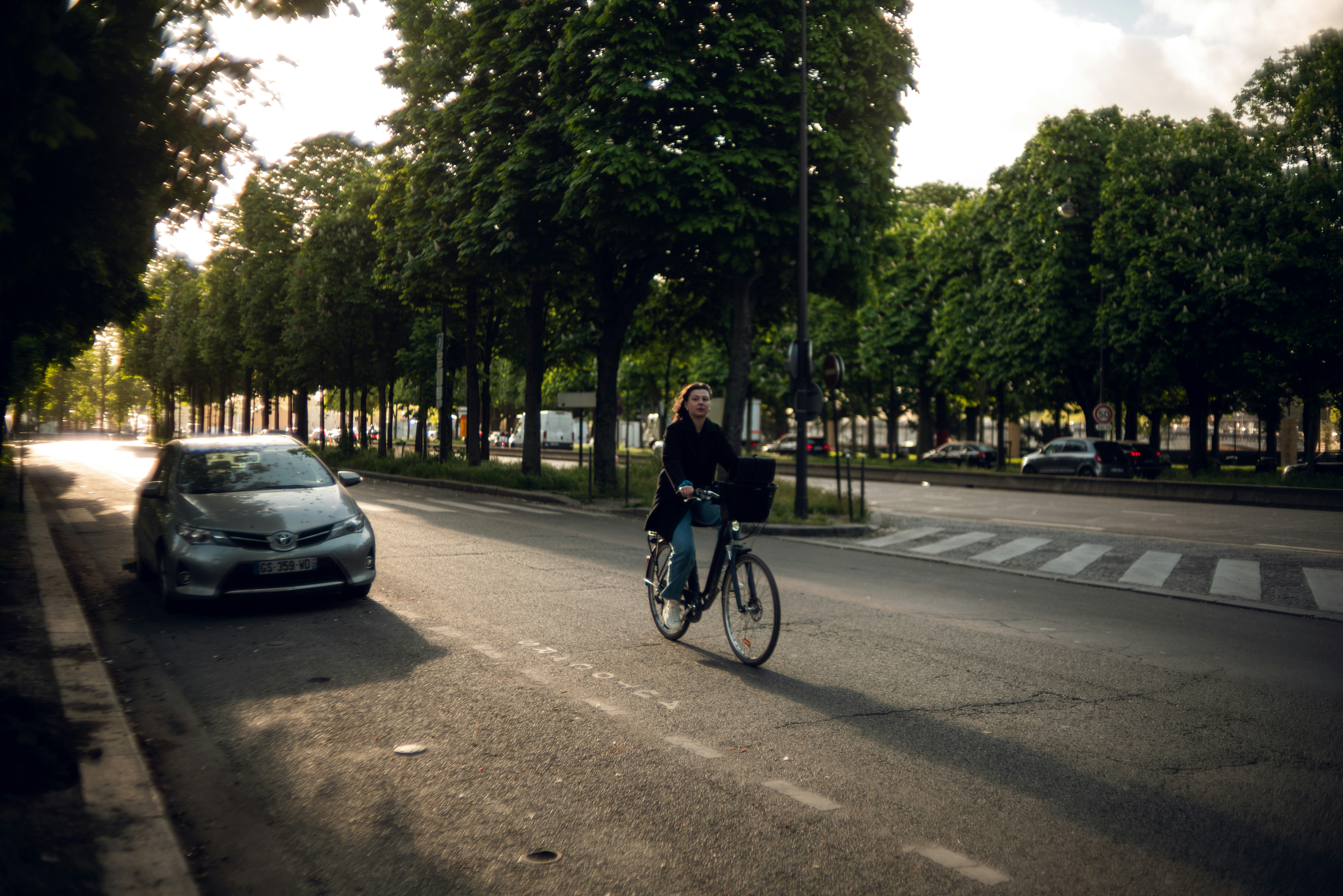 Cyclist riding a road bike outdoors in real conditions.