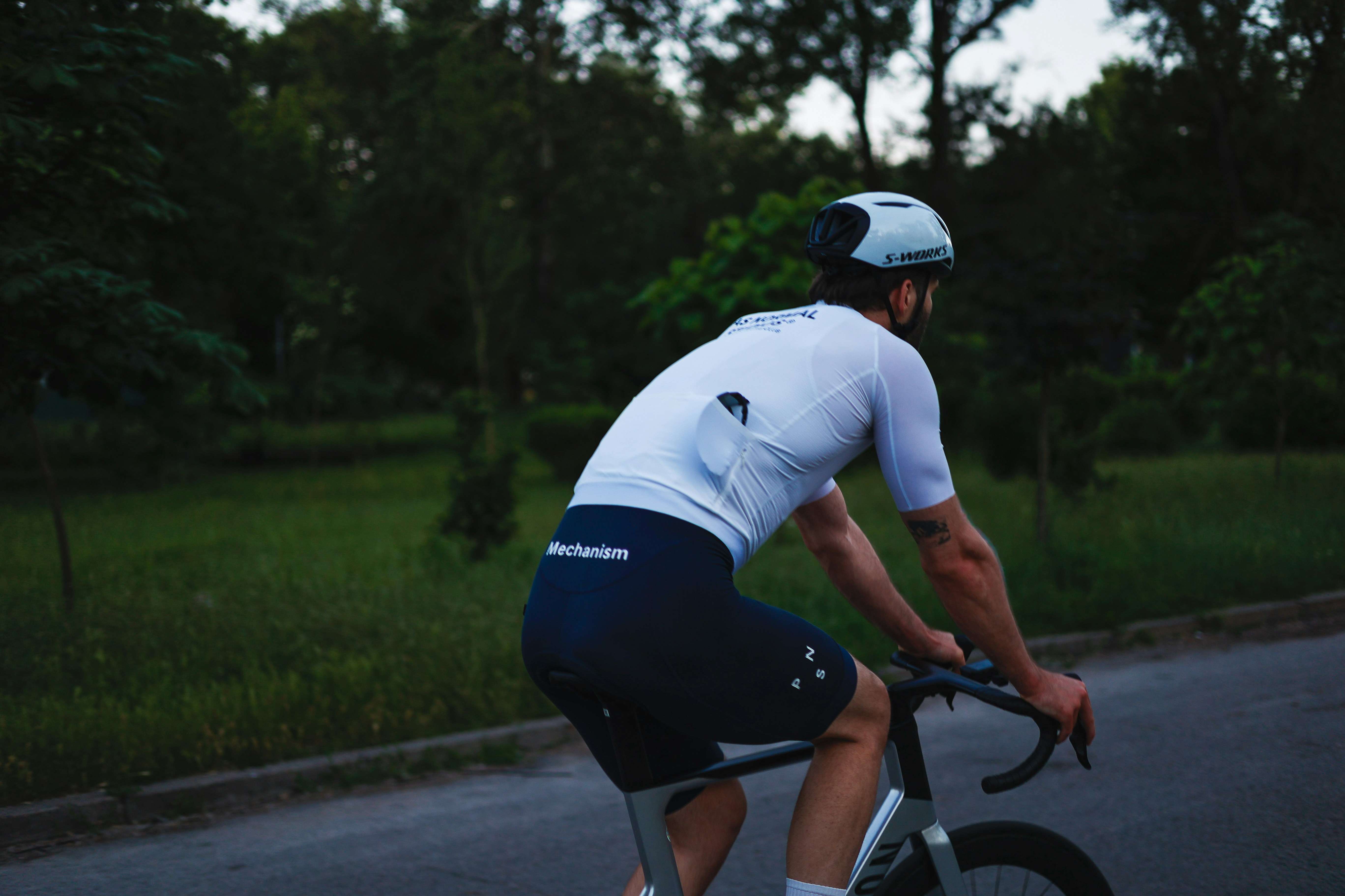 Cyclist riding a road bike outdoors in real conditions.