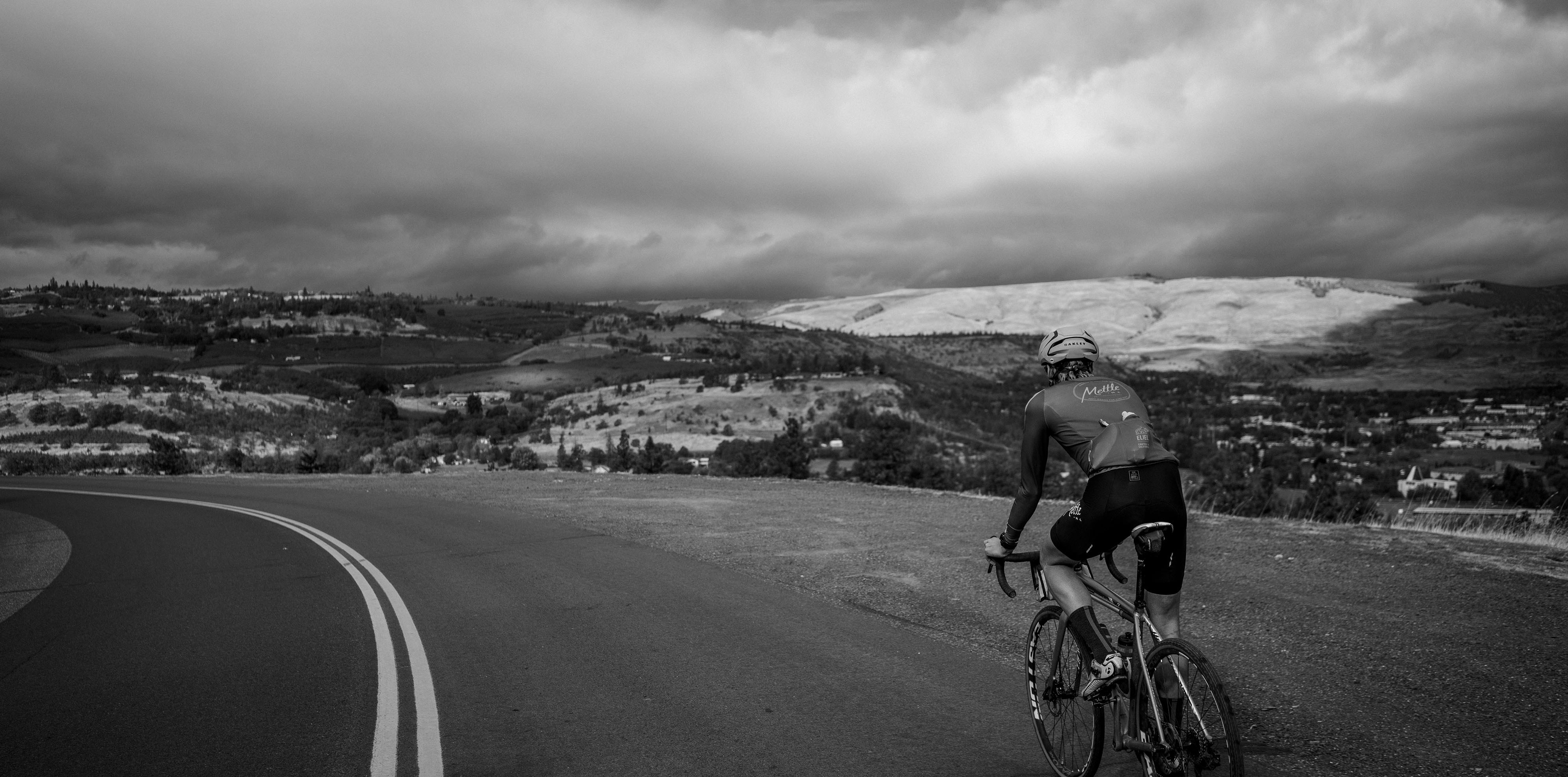 Cyclist riding a road bike outdoors in real conditions.