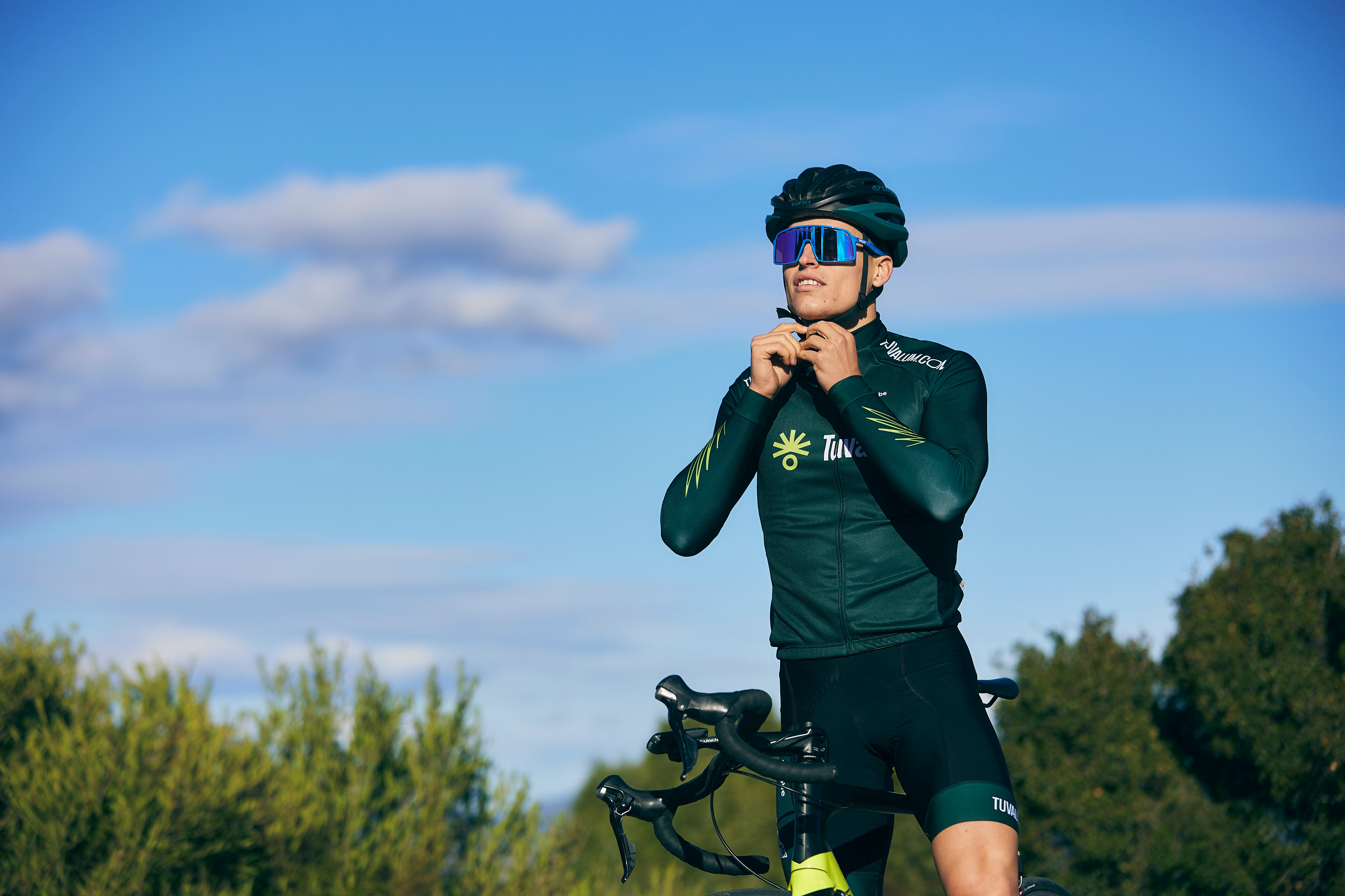 Cyclist riding a road bike outdoors in real conditions.