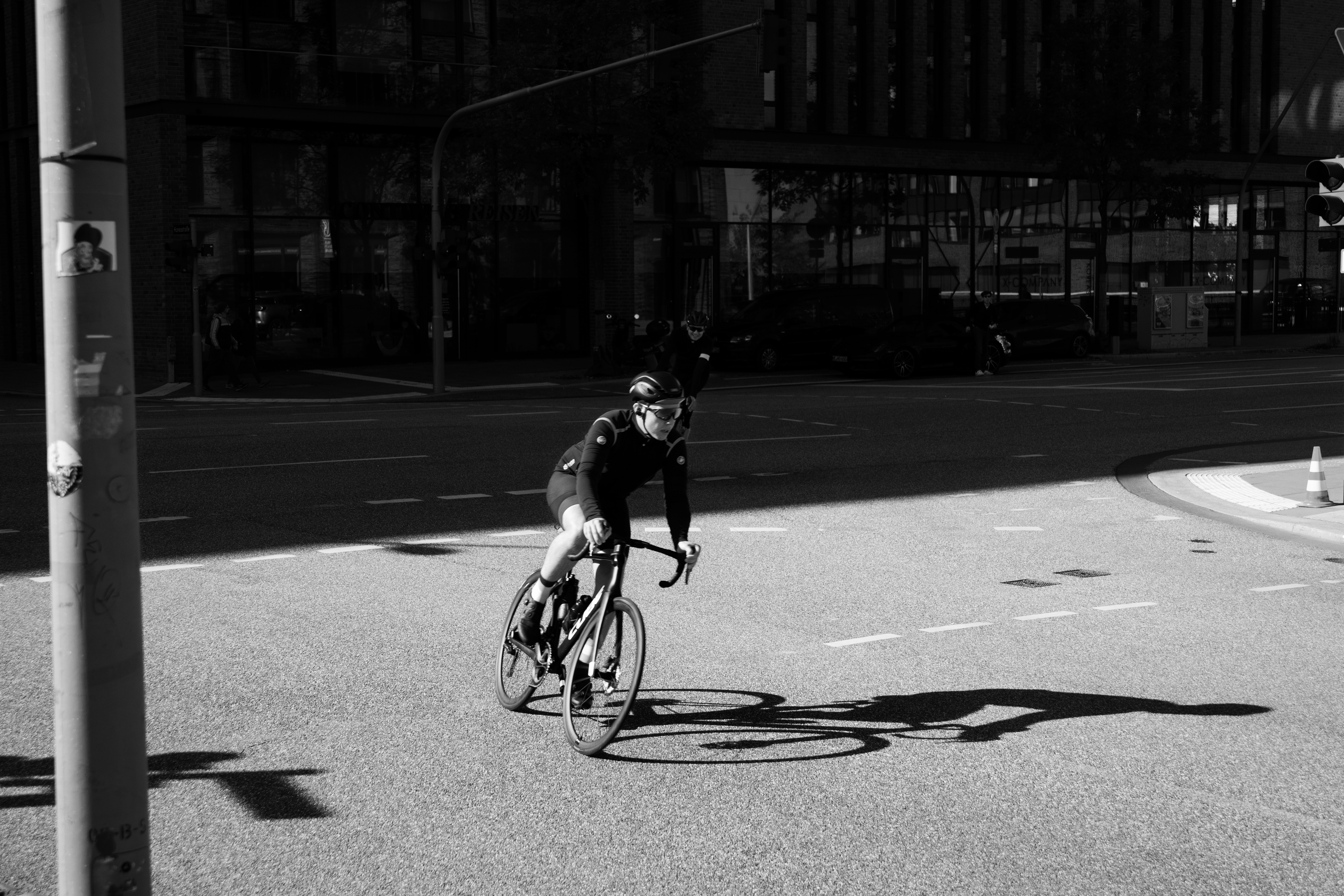 Cyclist riding a road bike outdoors in real conditions.