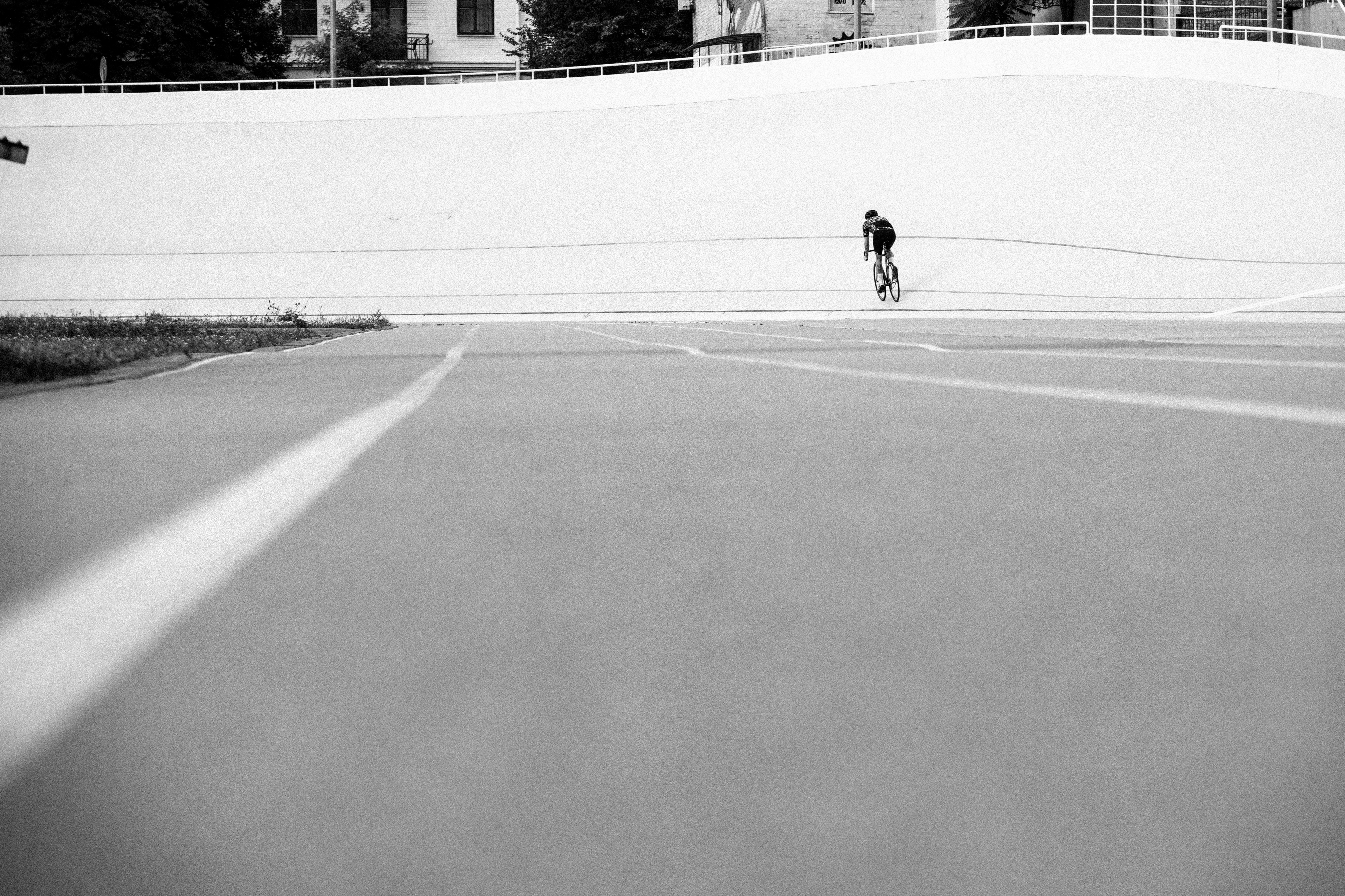 Cyclist riding a road bike outdoors in real conditions.