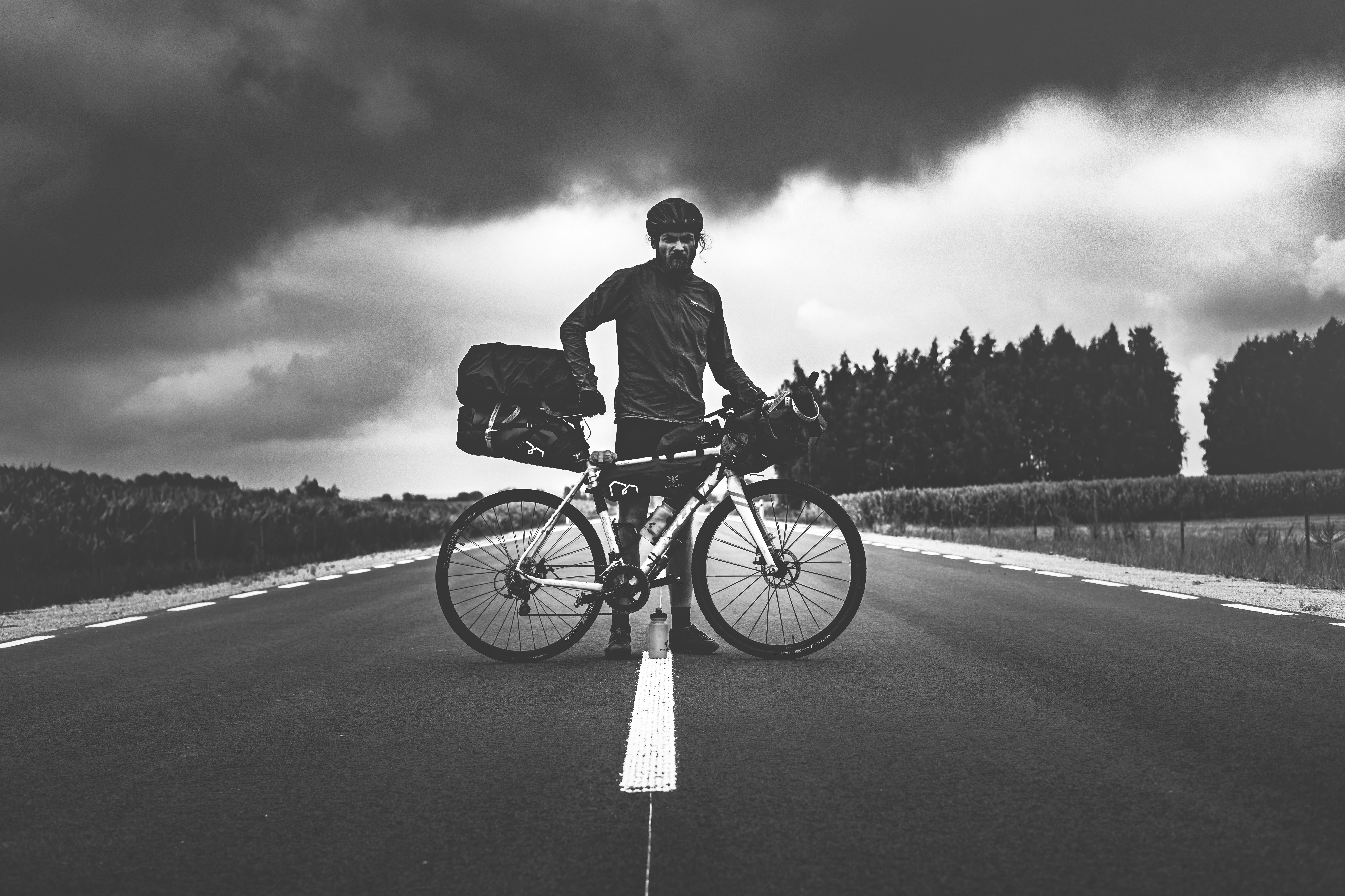 Cyclist riding a road bike outdoors in real conditions.