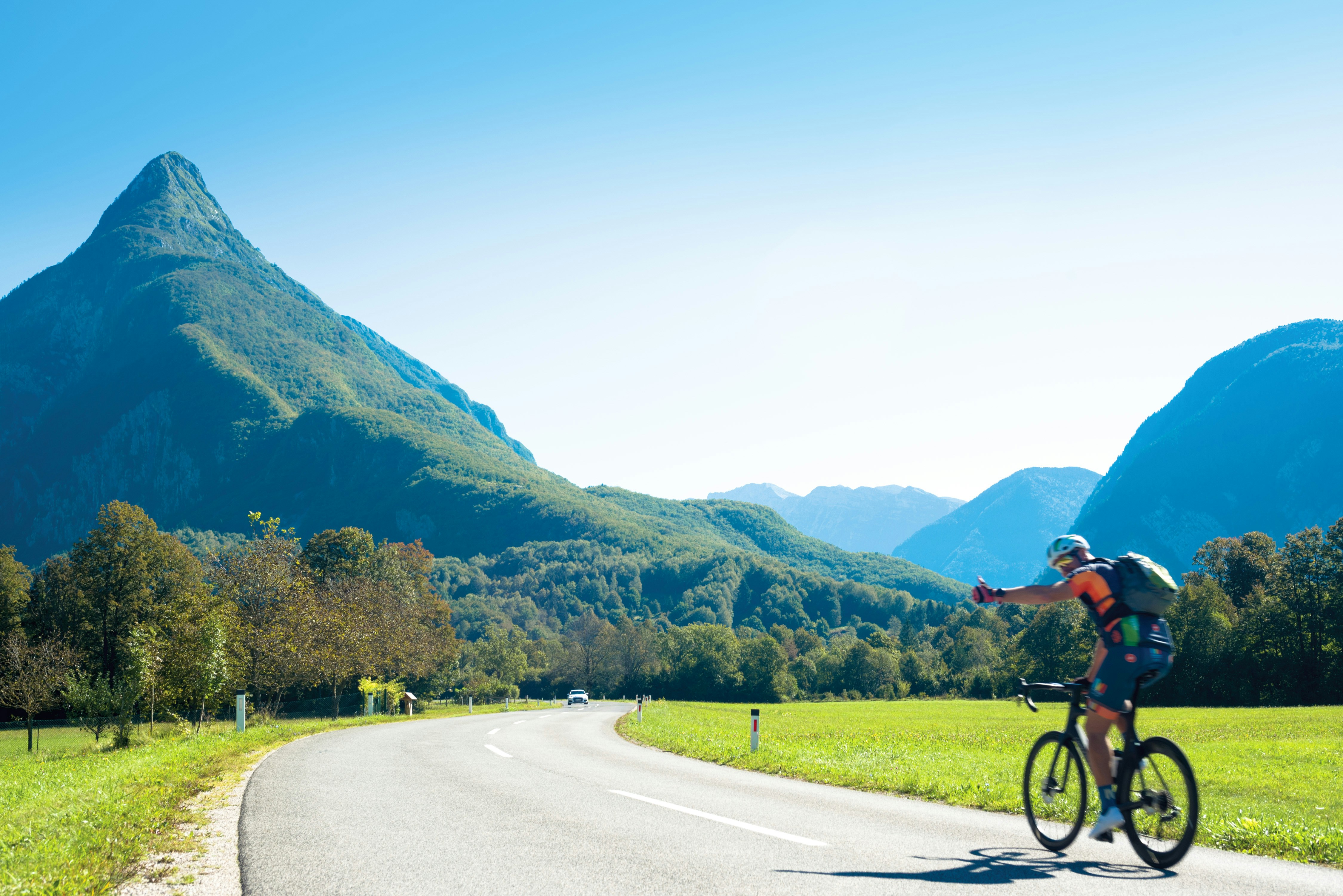 Cyclist riding a road bike outdoors in real conditions.
