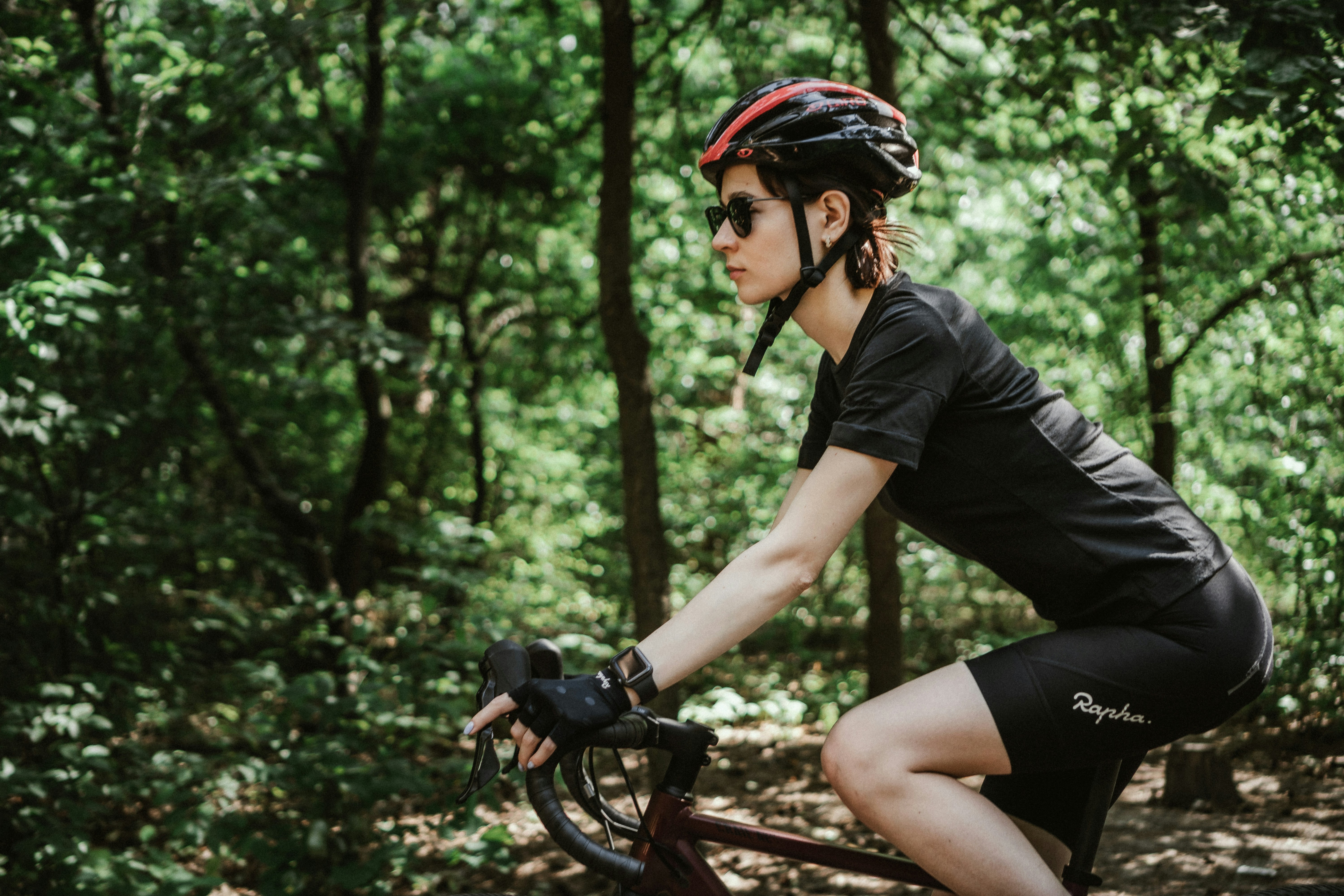 Cyclist riding a road bike outdoors in real conditions.