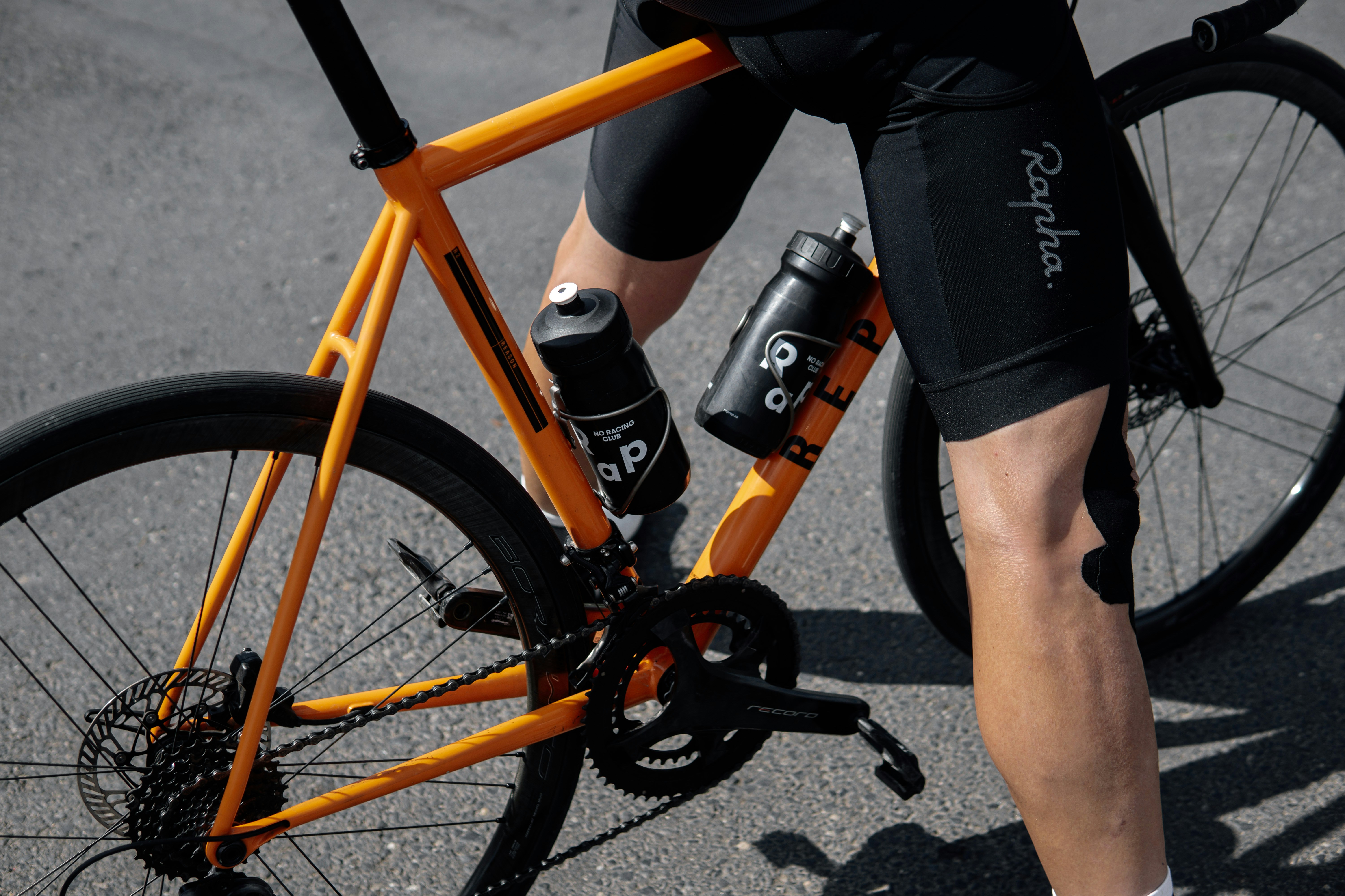 Cyclist riding a road bike outdoors in real conditions.