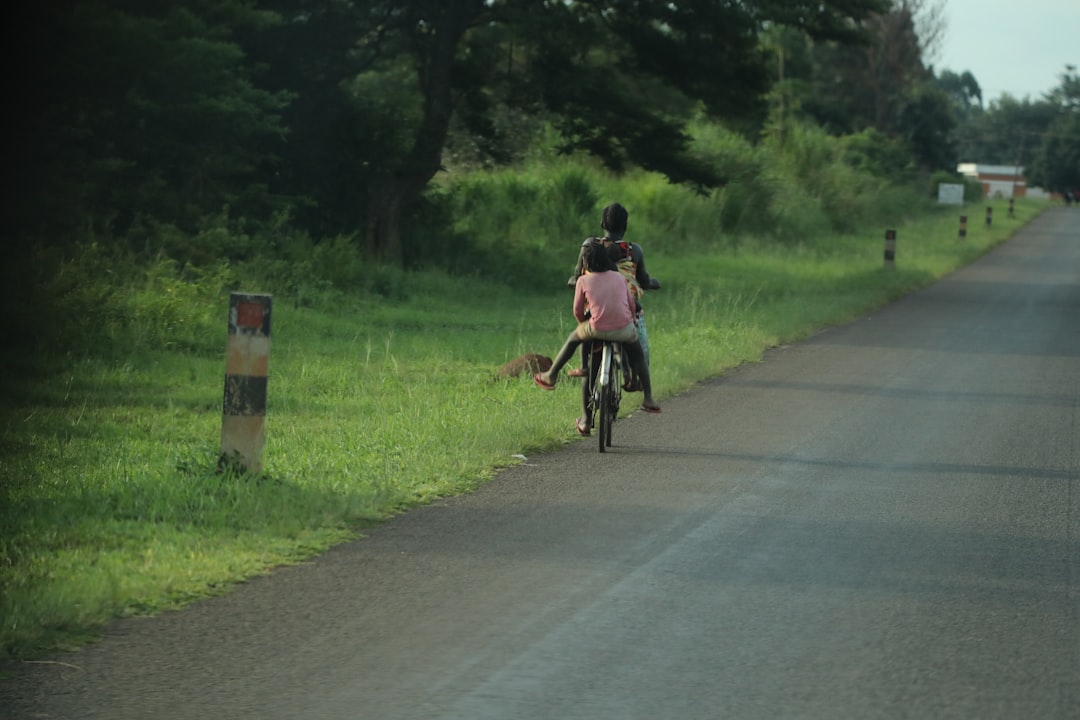 Group of road cyclists riding together outdoors on paved roads.
