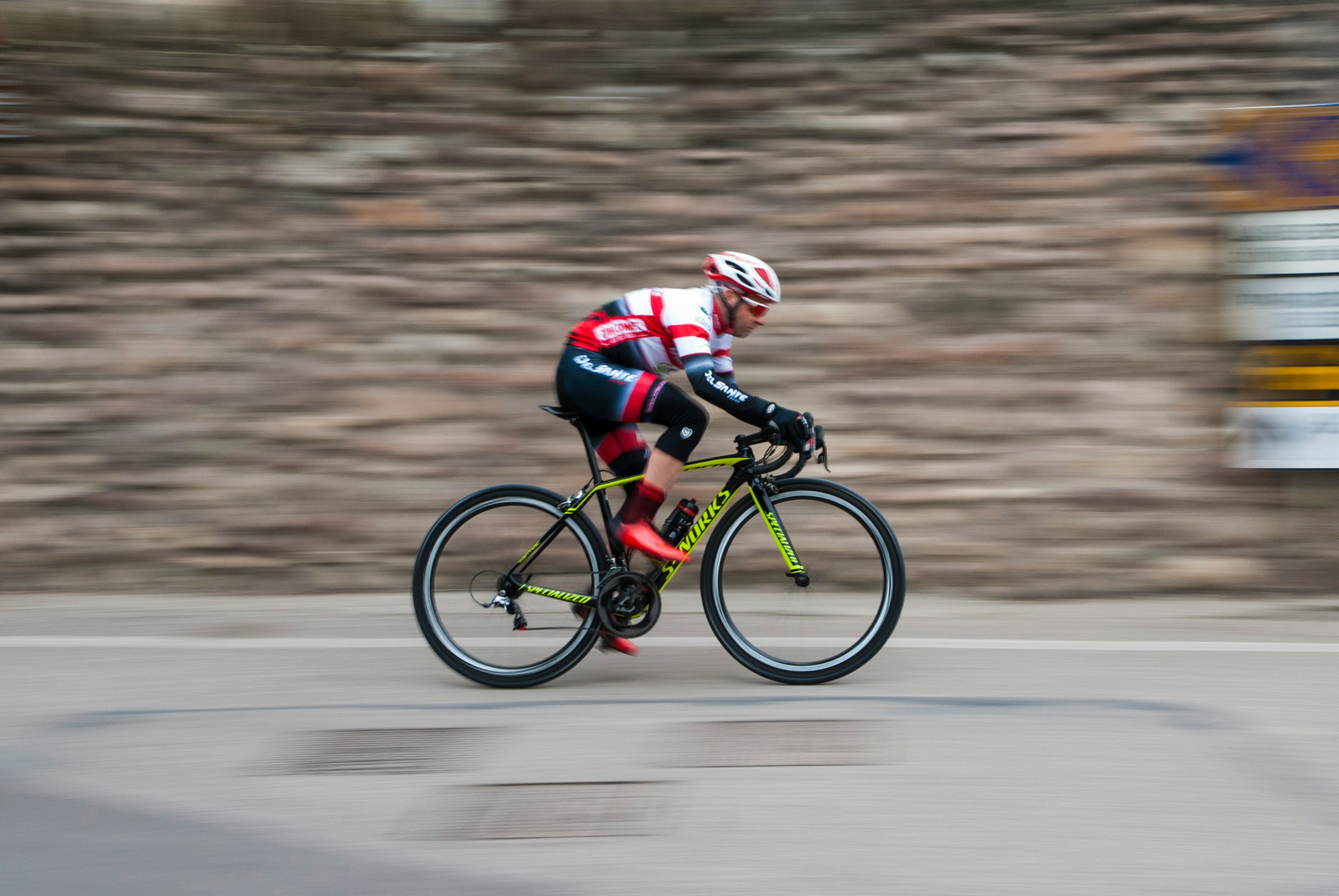 Cyclist riding a road bike outdoors in real conditions.