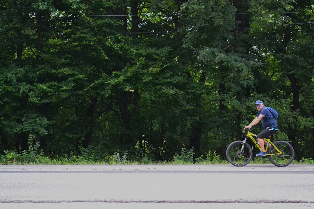 Group of road cyclists riding together outdoors on paved roads.