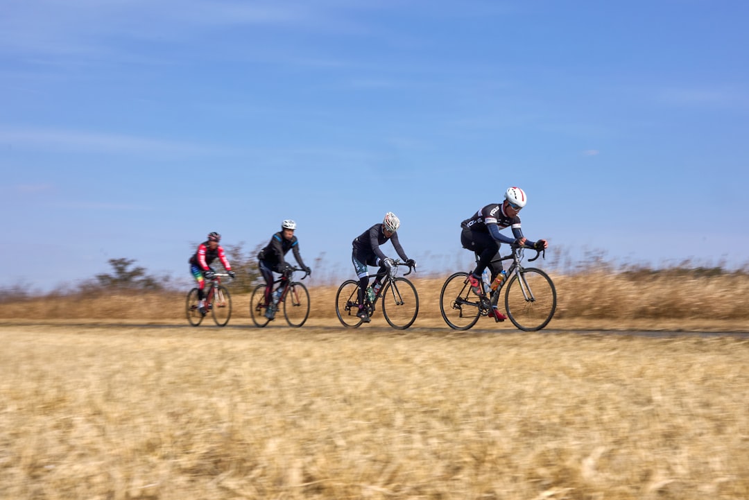 Group of cyclists on an endurance ride in morning light.