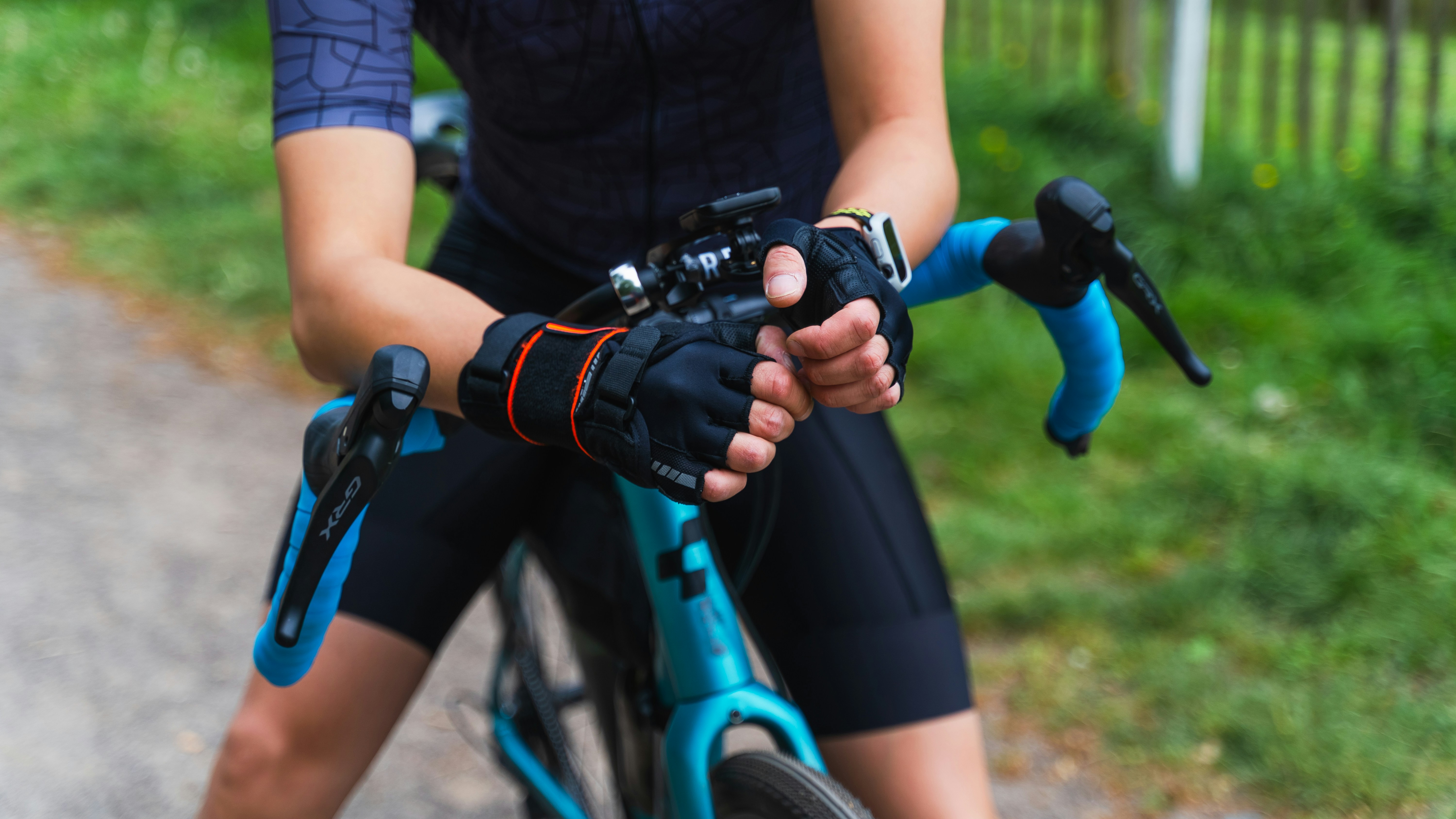 Cyclist riding a road bike outdoors in real conditions.