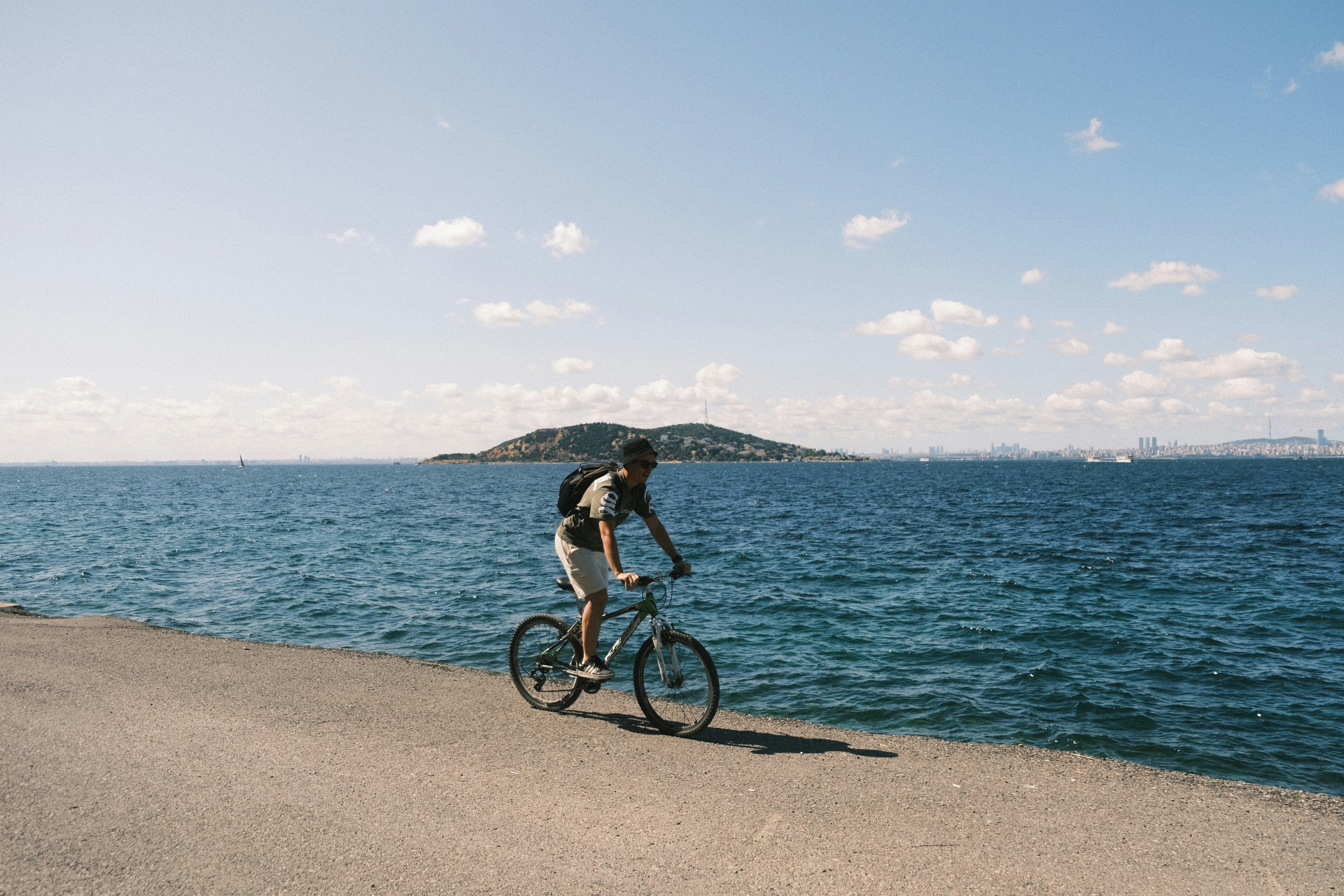 Cyclist riding a road bike outdoors in real conditions.