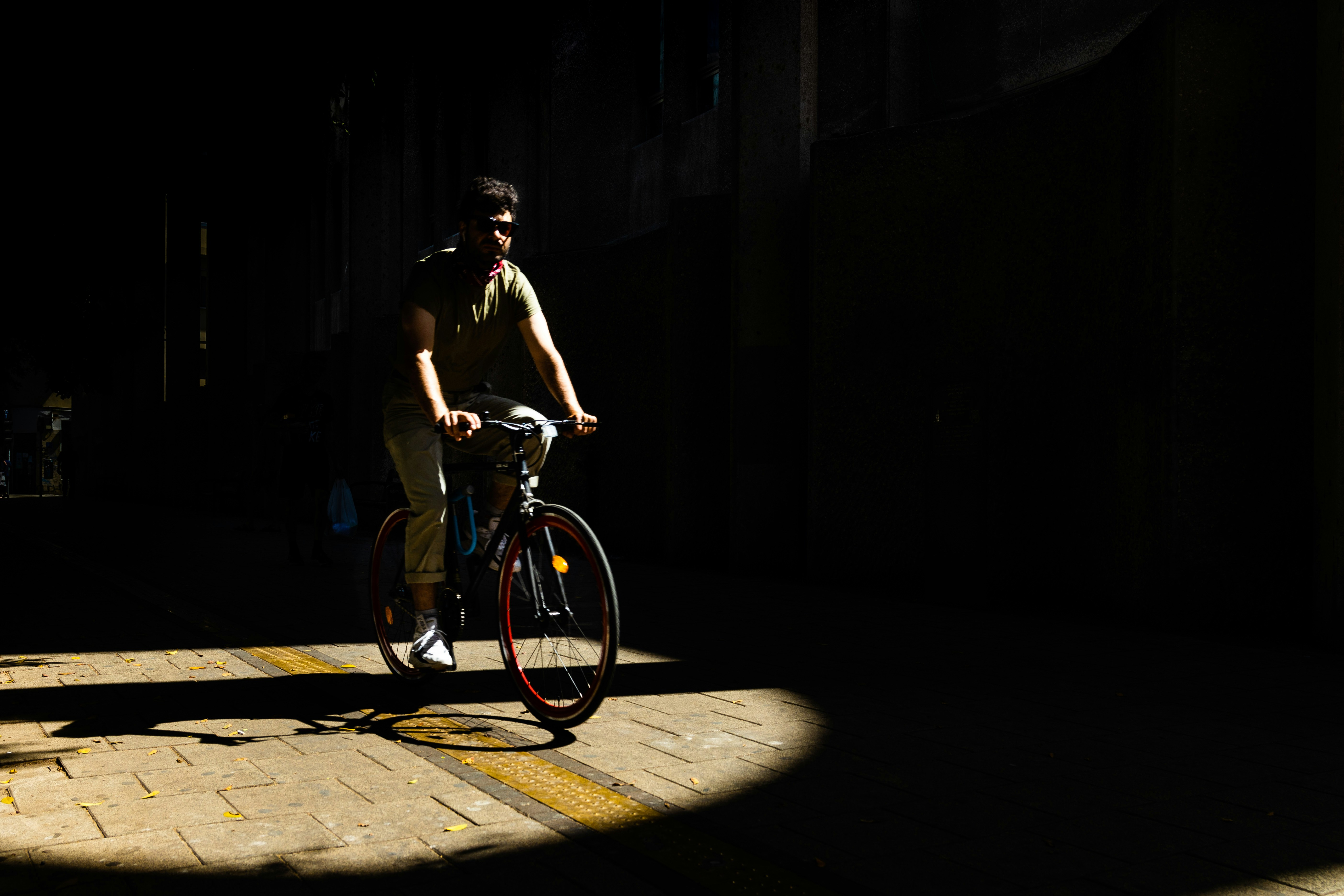 Cyclist riding a road bike outdoors in real conditions.