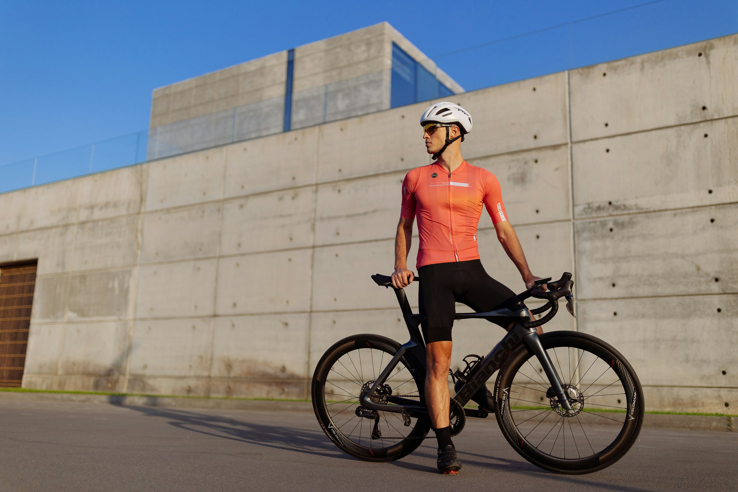 Cyclist riding a road bike outdoors in real conditions.