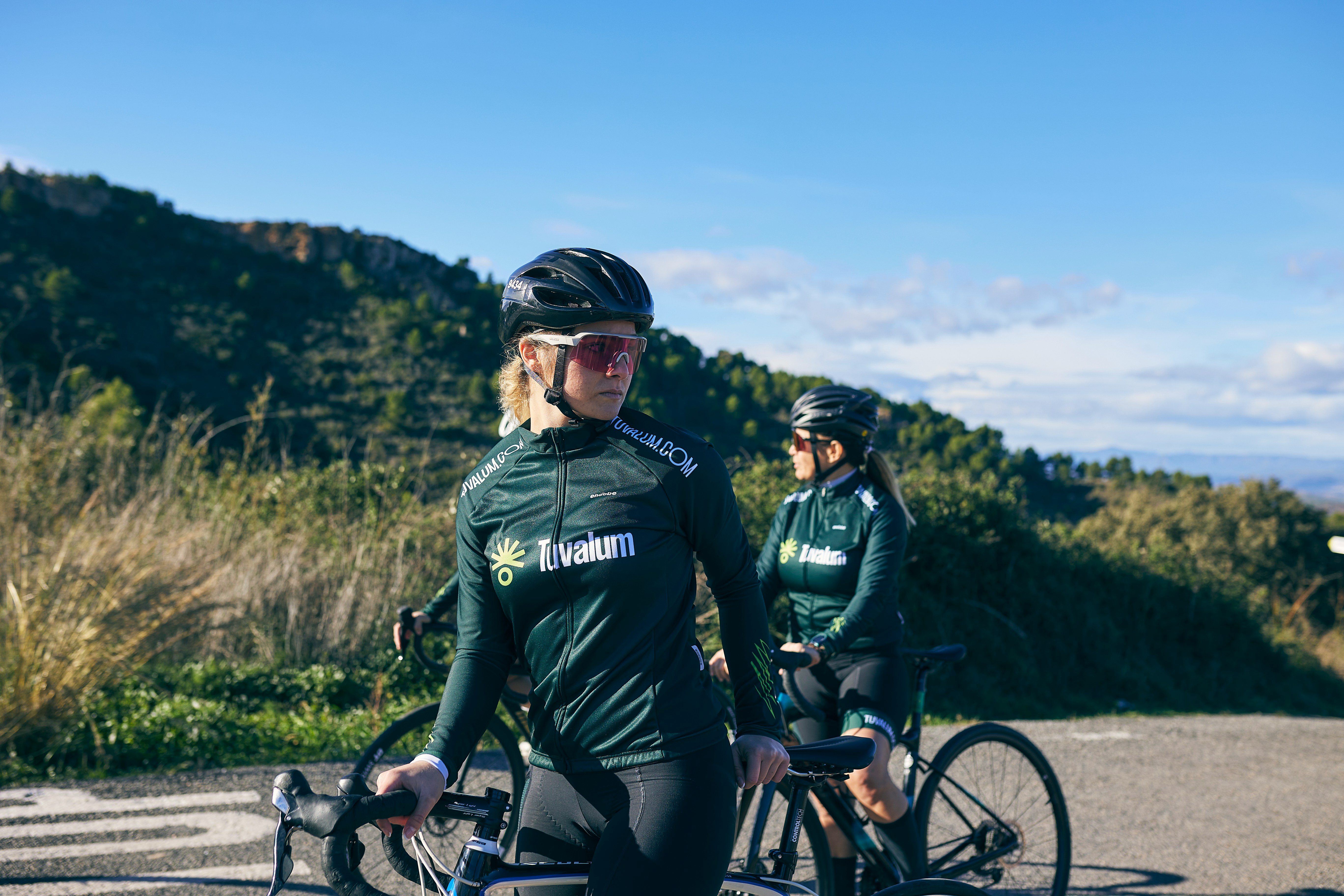 Cyclist riding a road bike outdoors in real conditions.