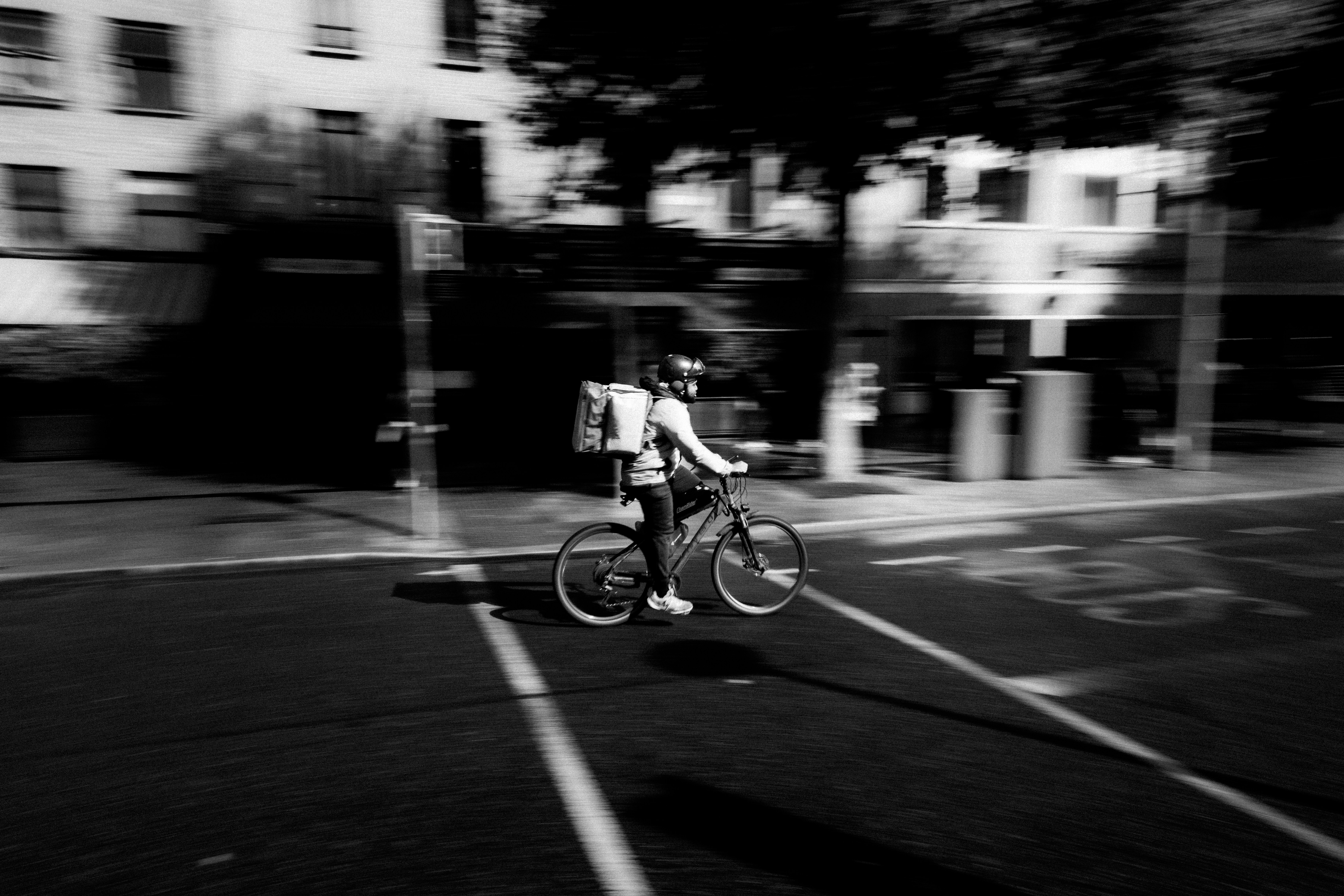 Cyclist riding a road bike outdoors in real conditions.