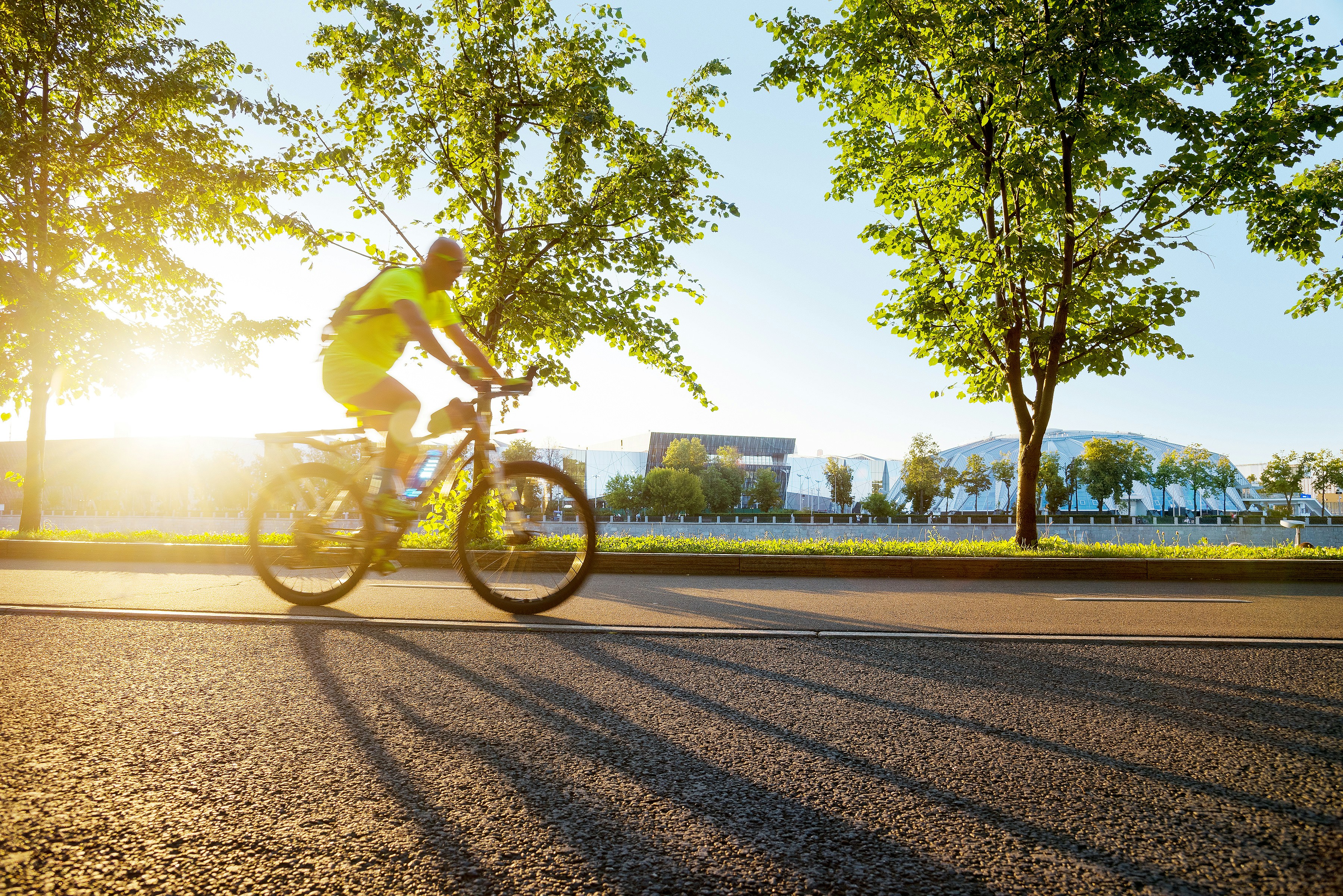 Cyclist riding a road bike outdoors in real conditions.